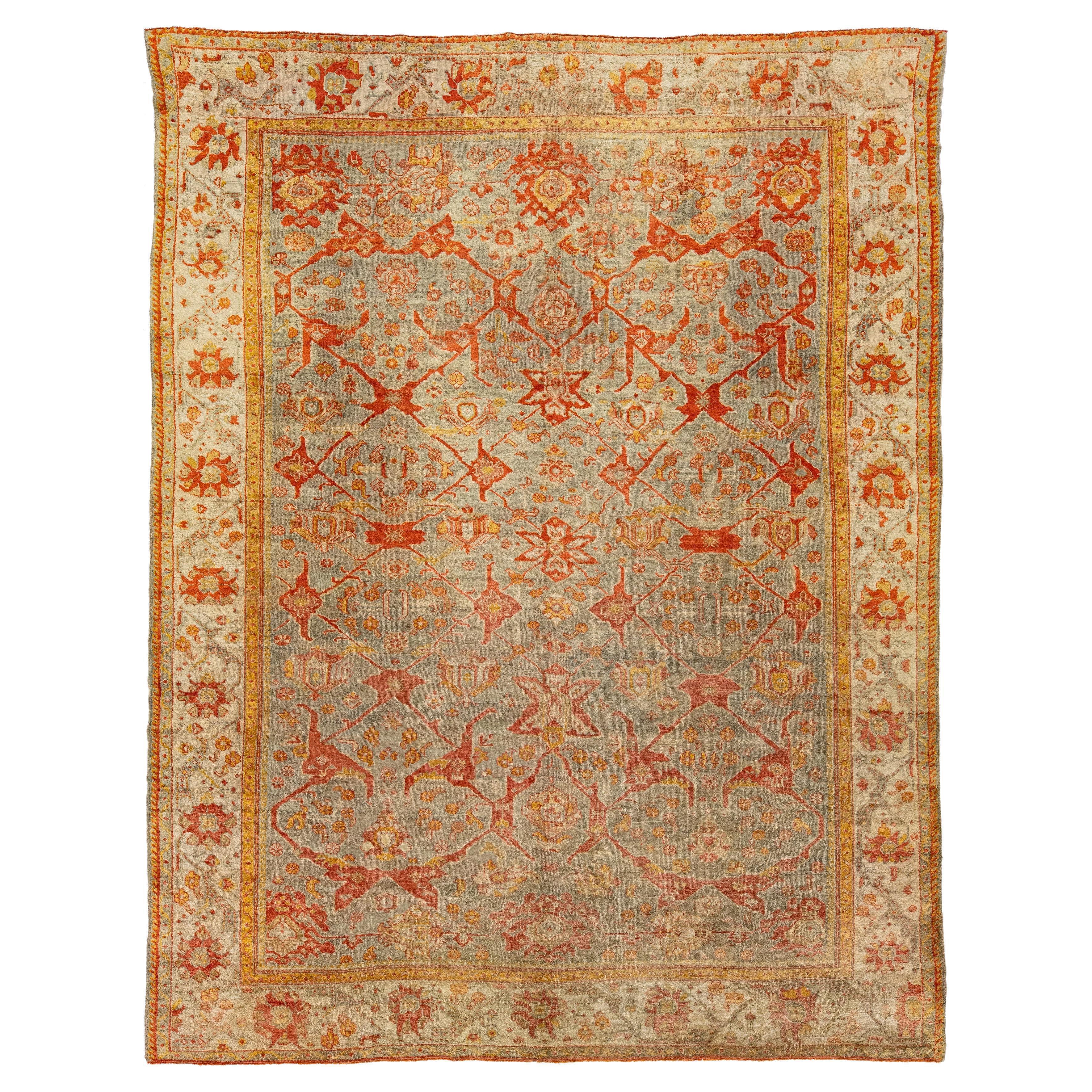 Türkischer Oushak-Teppich aus antiker Wolle, handgefertigt, mit Blumenmuster in Rost 
