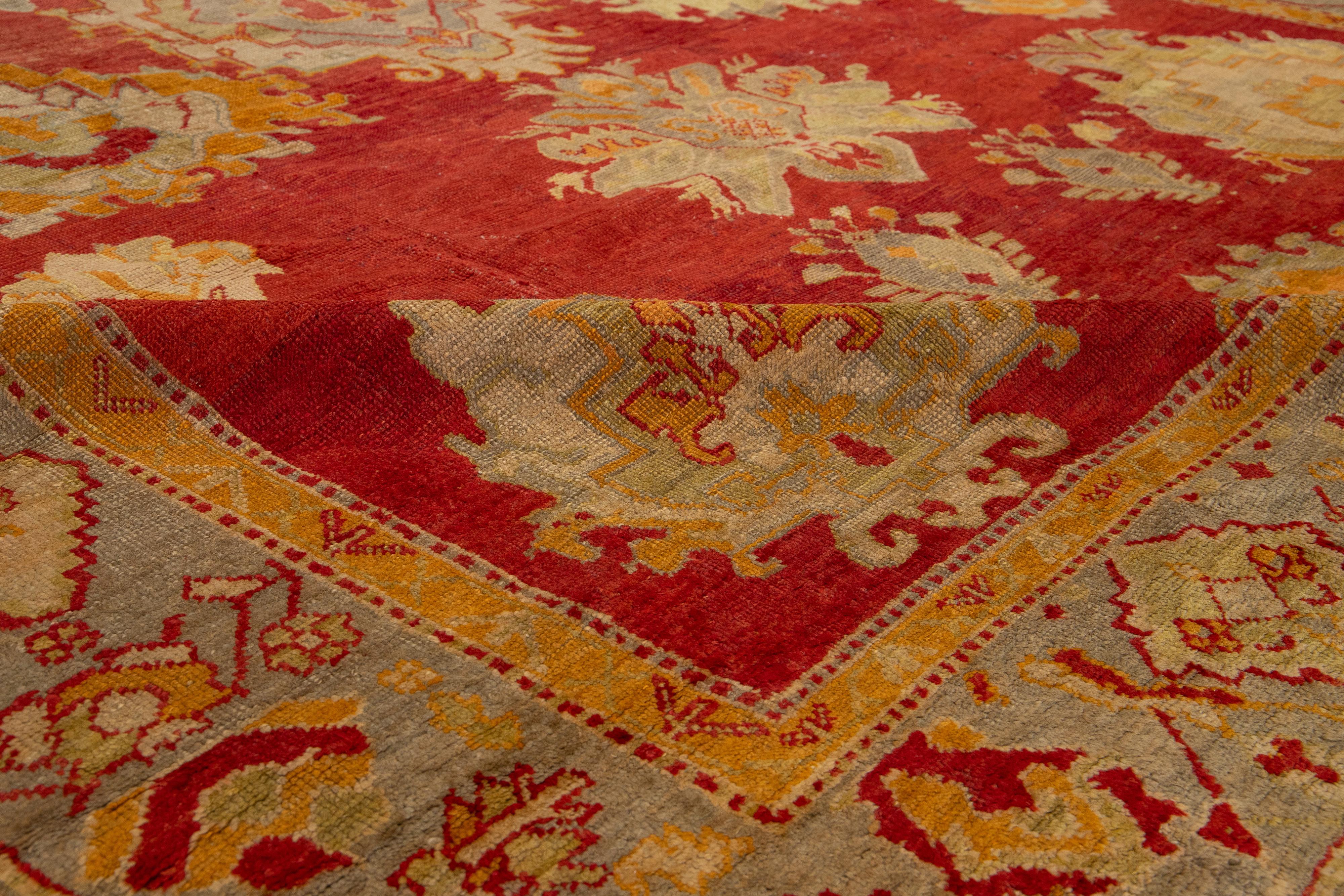Turkish Oushak Antique Wool Rug Handmade In Red Featuring a Floral Design For Sale 5