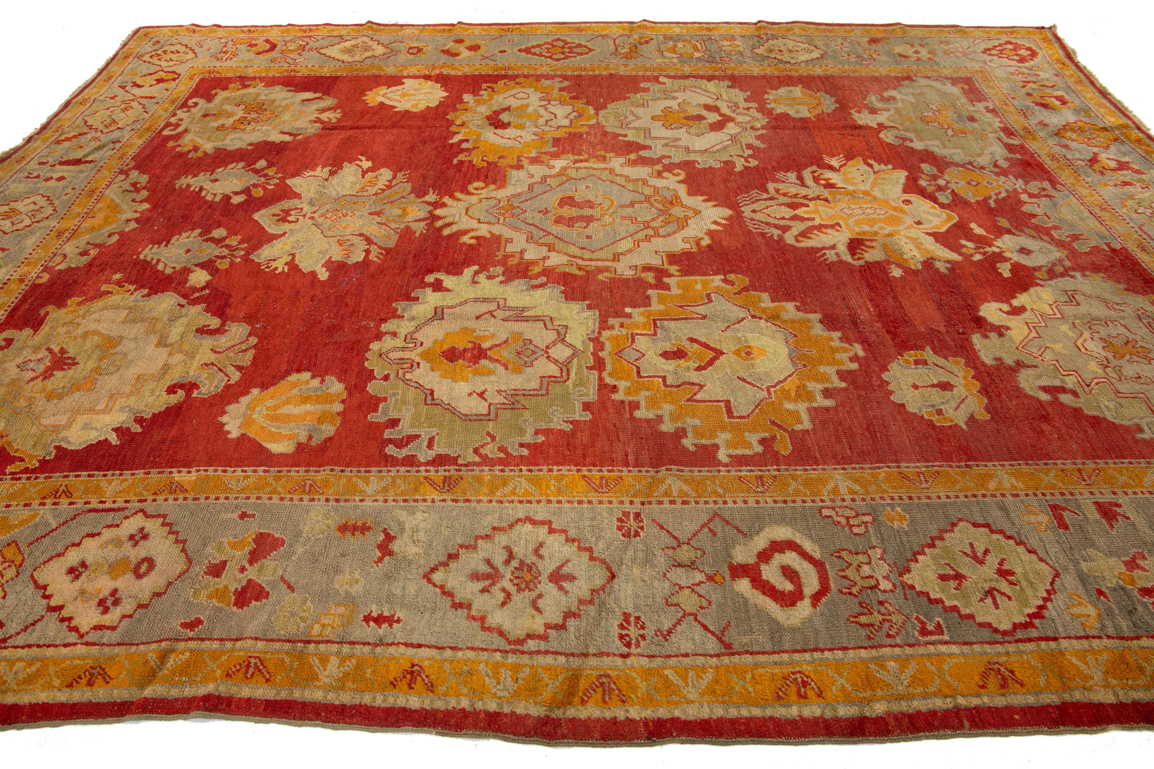 Turkish Oushak Antique Wool Rug Handmade In Red Featuring a Floral Design For Sale 1