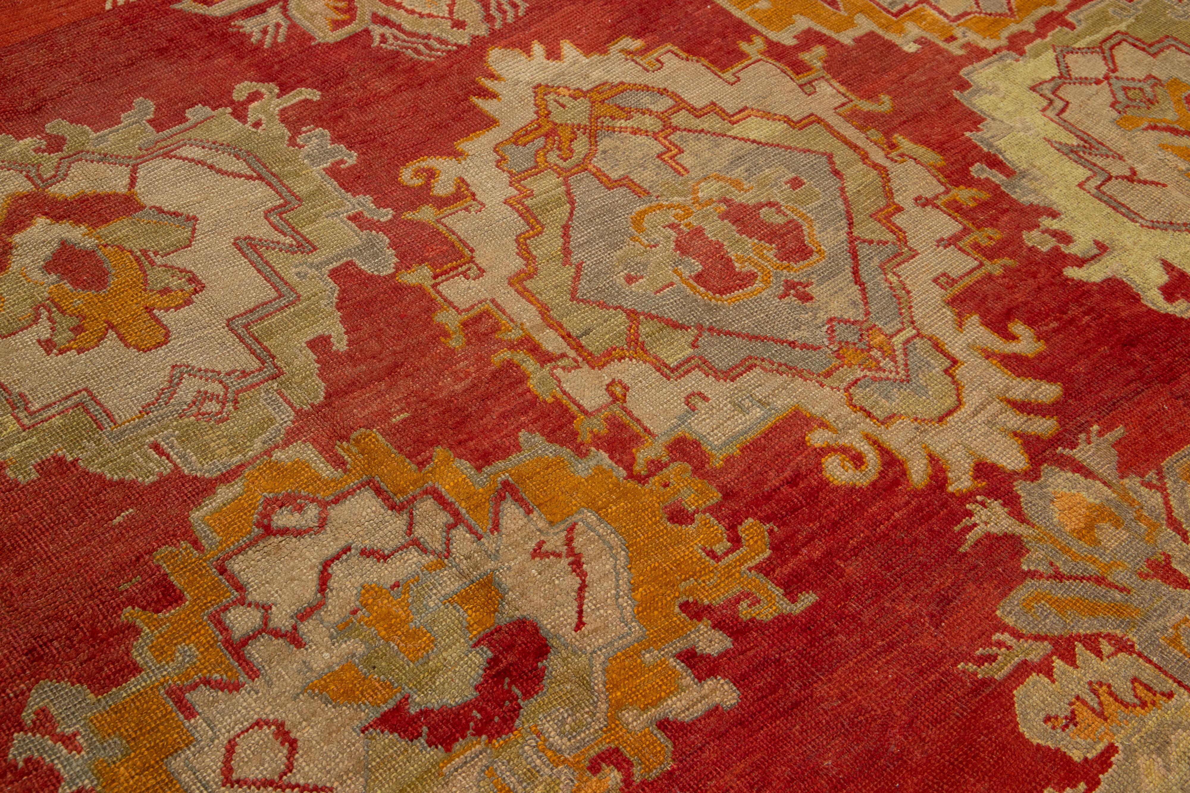 Turkish Oushak Antique Wool Rug Handmade In Red Featuring a Floral Design For Sale 4