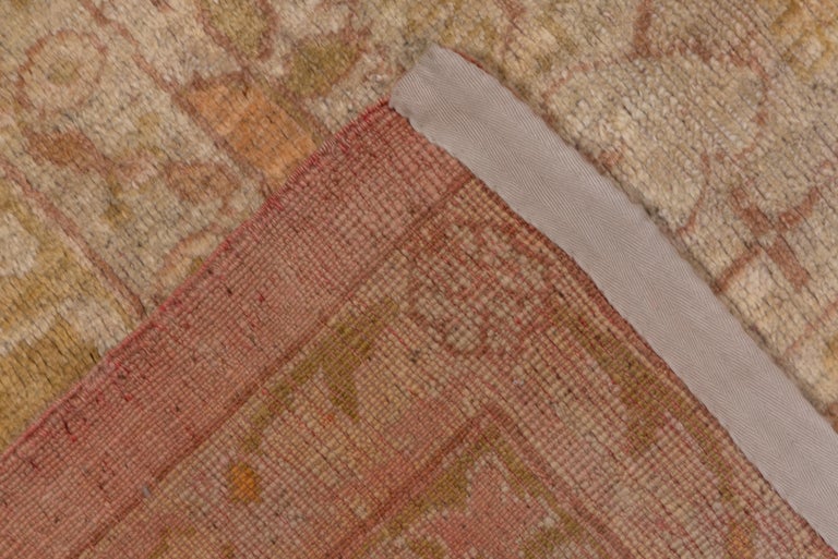 Turkish Oushak Carpet, Light Pink Field, circa 1910s For Sale at 1stdibs
