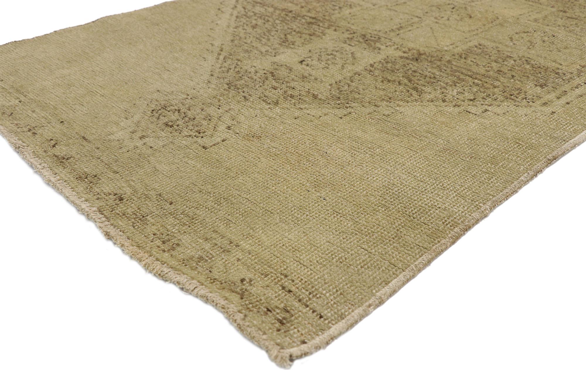 This extraordinary Oushak runner from the Provincial weaving center of Ushak features a magnificent triple medallion with a washed out alabaster beige field. The elegant neutral field tastefully blends into the Minimalist wash out background. The