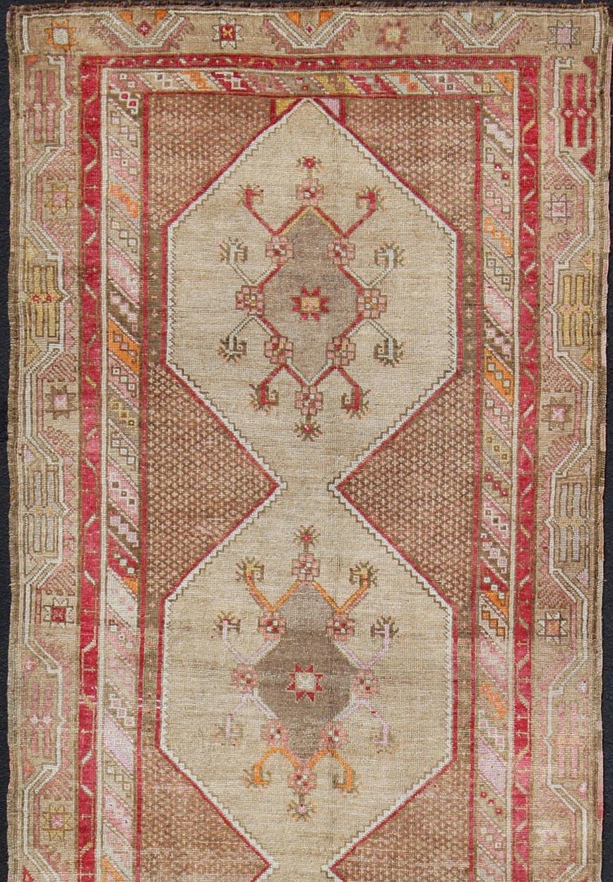 Hand-Knotted Turkish Oushak Gallery Rug with Multi-Medallion Design in Earth Tones and Red For Sale