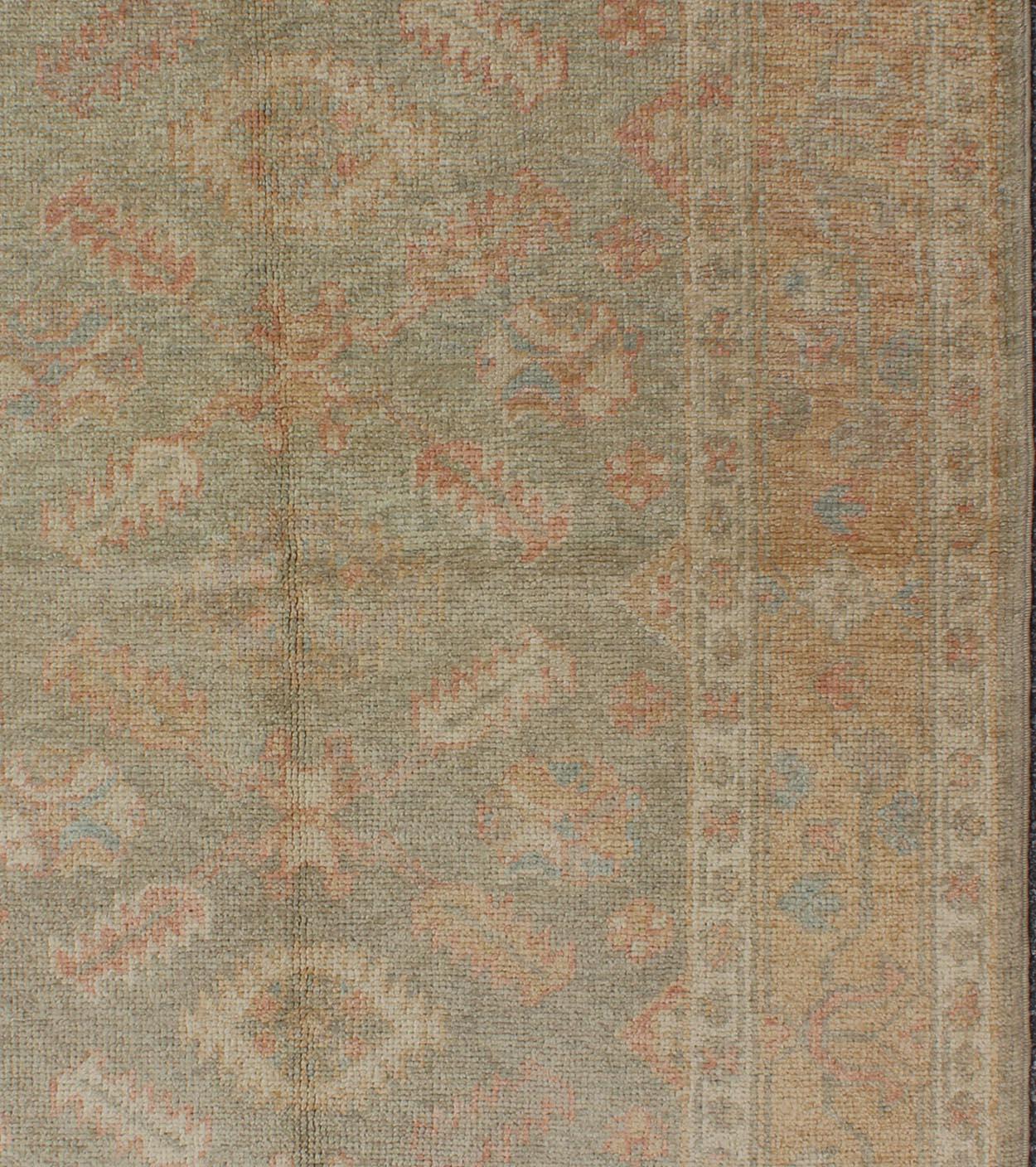 Floral reproduction Oushak rug from Turkey, rug EN-345, country of origin / type: Turkey / Oushak, circa 2000

This reproduction Turkish Oushak rug features a garden-inspired design of various blossom motifs. The large, multi-banded border