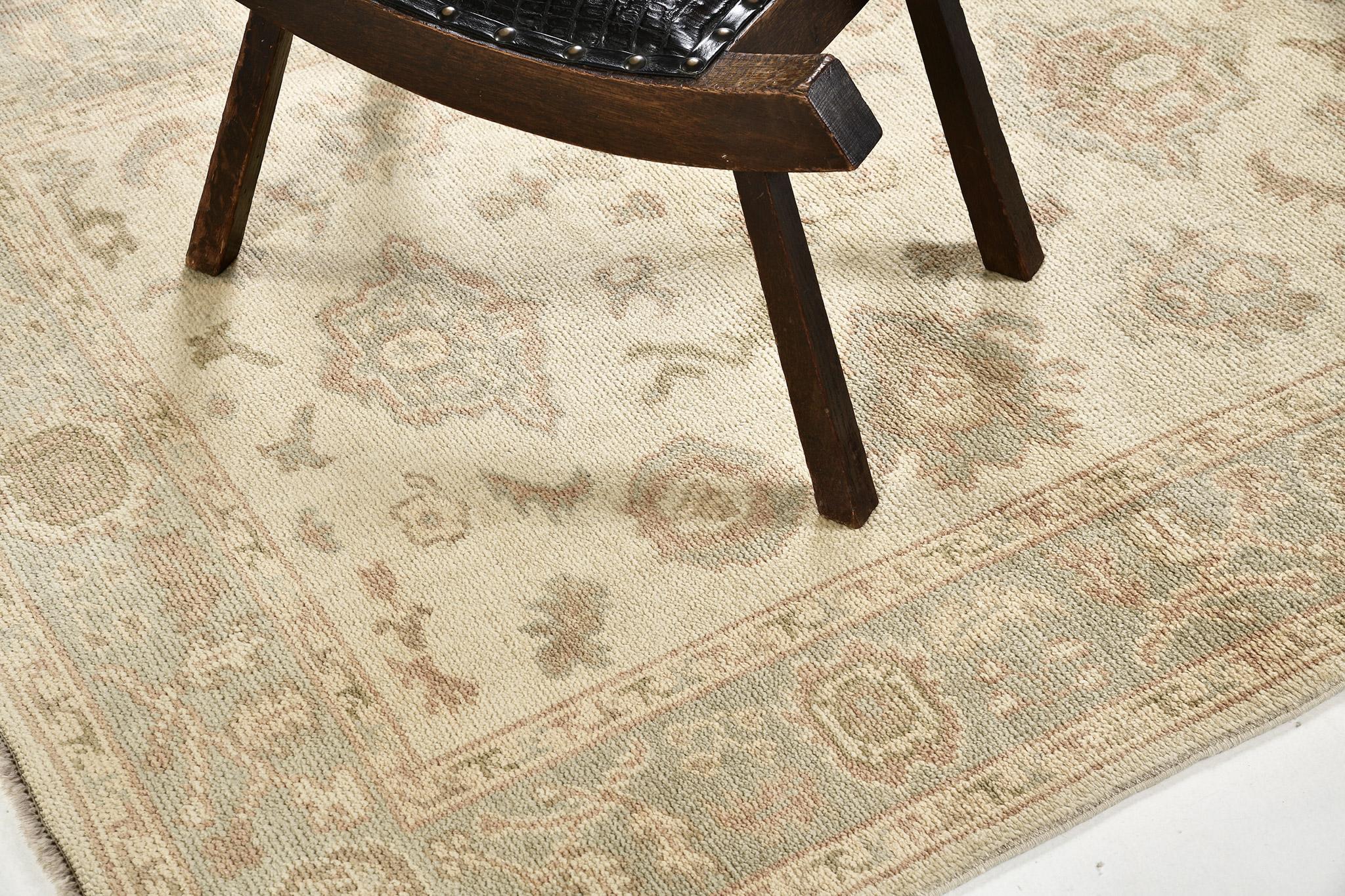 A gracefully composed Oushak revival rug that is a magnificent illustration of class, soft beauty and serenity. Distinctive palmettes, graceful peonies and florid patterns are showcasing sophisticated elegance in the remarkable shades of cinnamon,