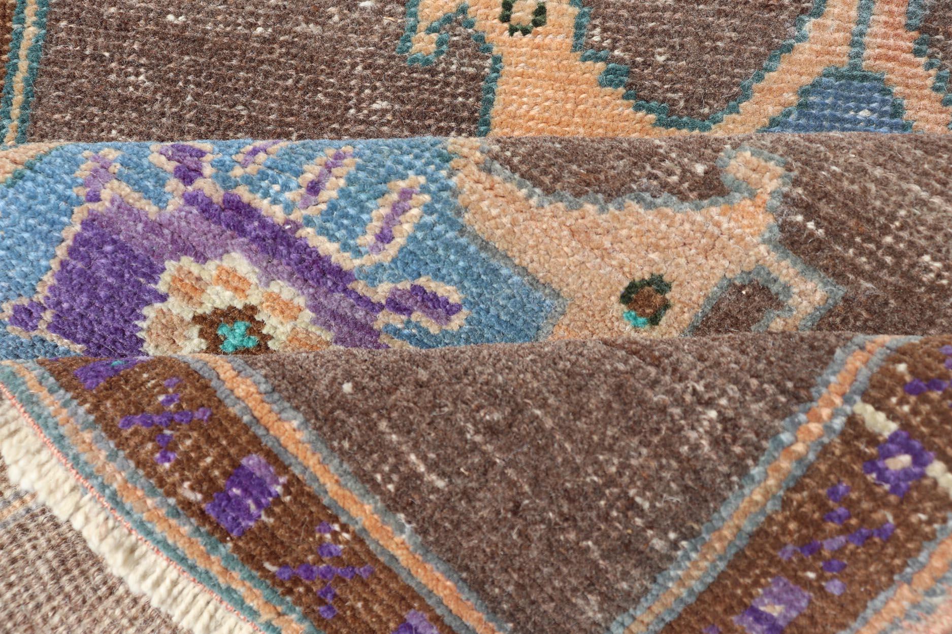 Measures: 2'7 x 3'7 Turkish Oushak Rug -Bold Brown and Vibrant Blue Floral Medallions Keivan Woven Arts / Rug / EN-14916 Country of origin / type: Turkey / Oushak exquisite Vintage Turkish Oushak rug showcases a rich brown background beautifully