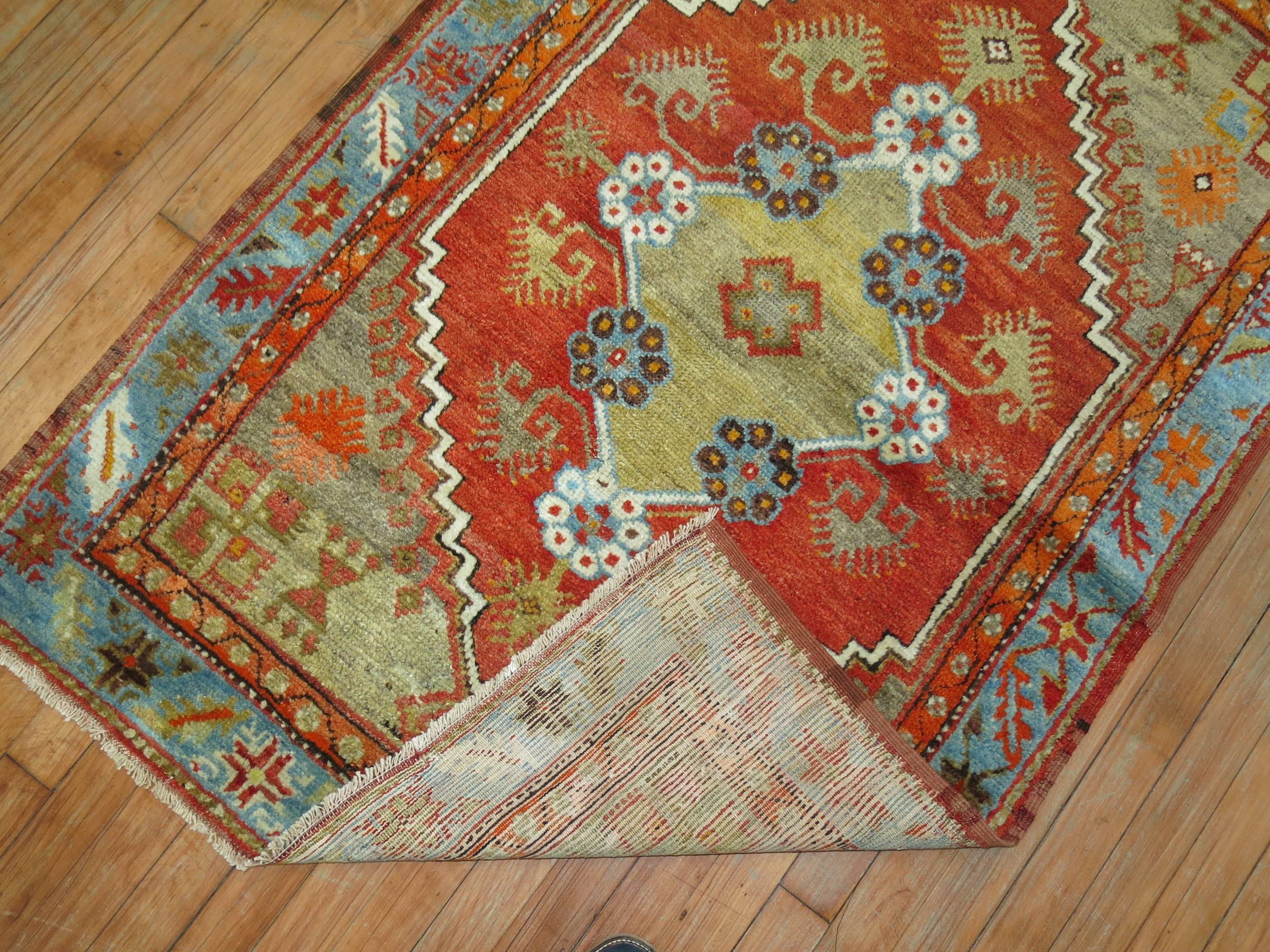 A colorful one of a kind scatter size antique Turkish Oushak rug.