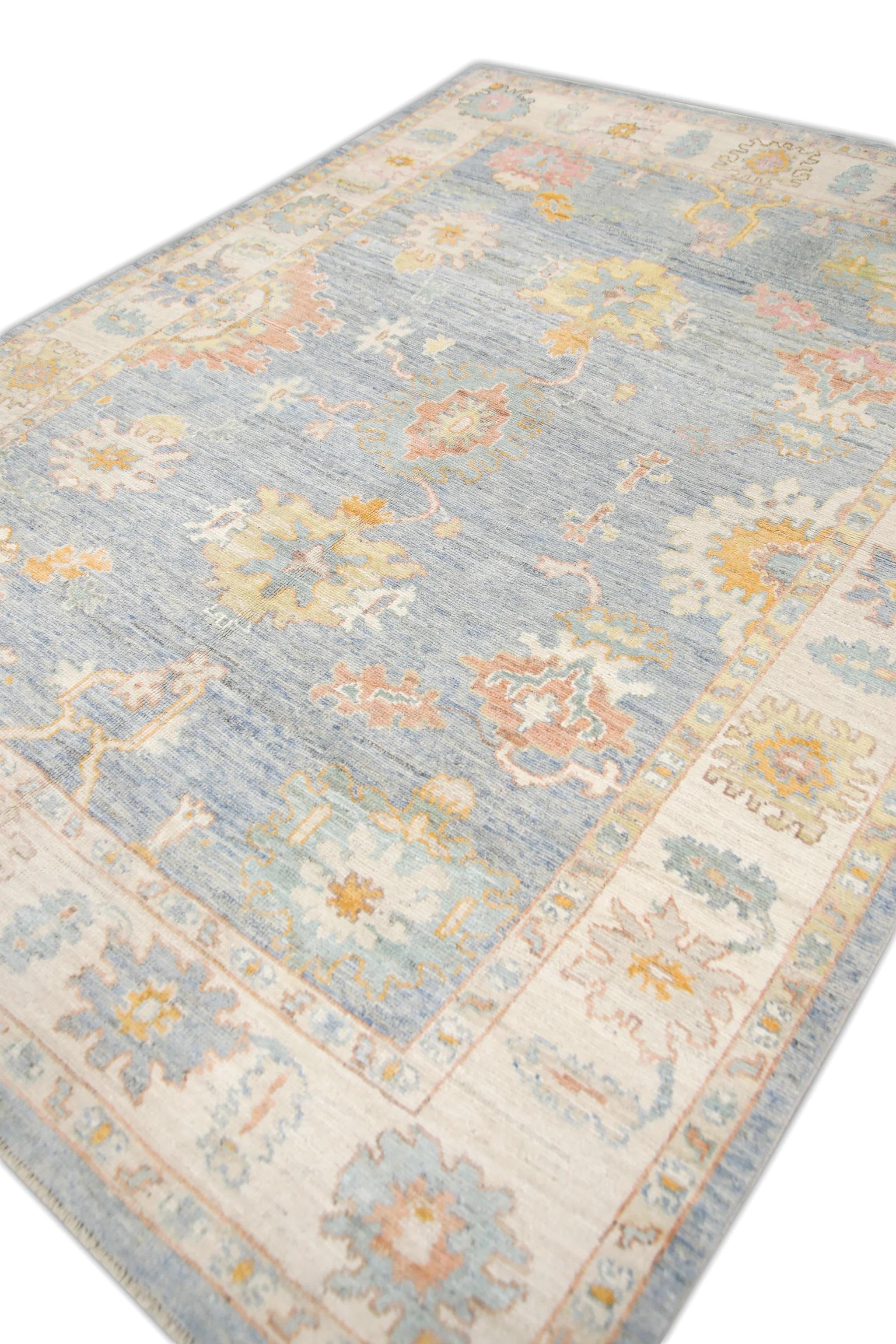 This Turkish oushak rug is a stunning piece of art that has been handwoven using traditional techniques by skilled artisans. The rug features intricate patterns and a soft color palette that is achieved through the use of natural vegetable