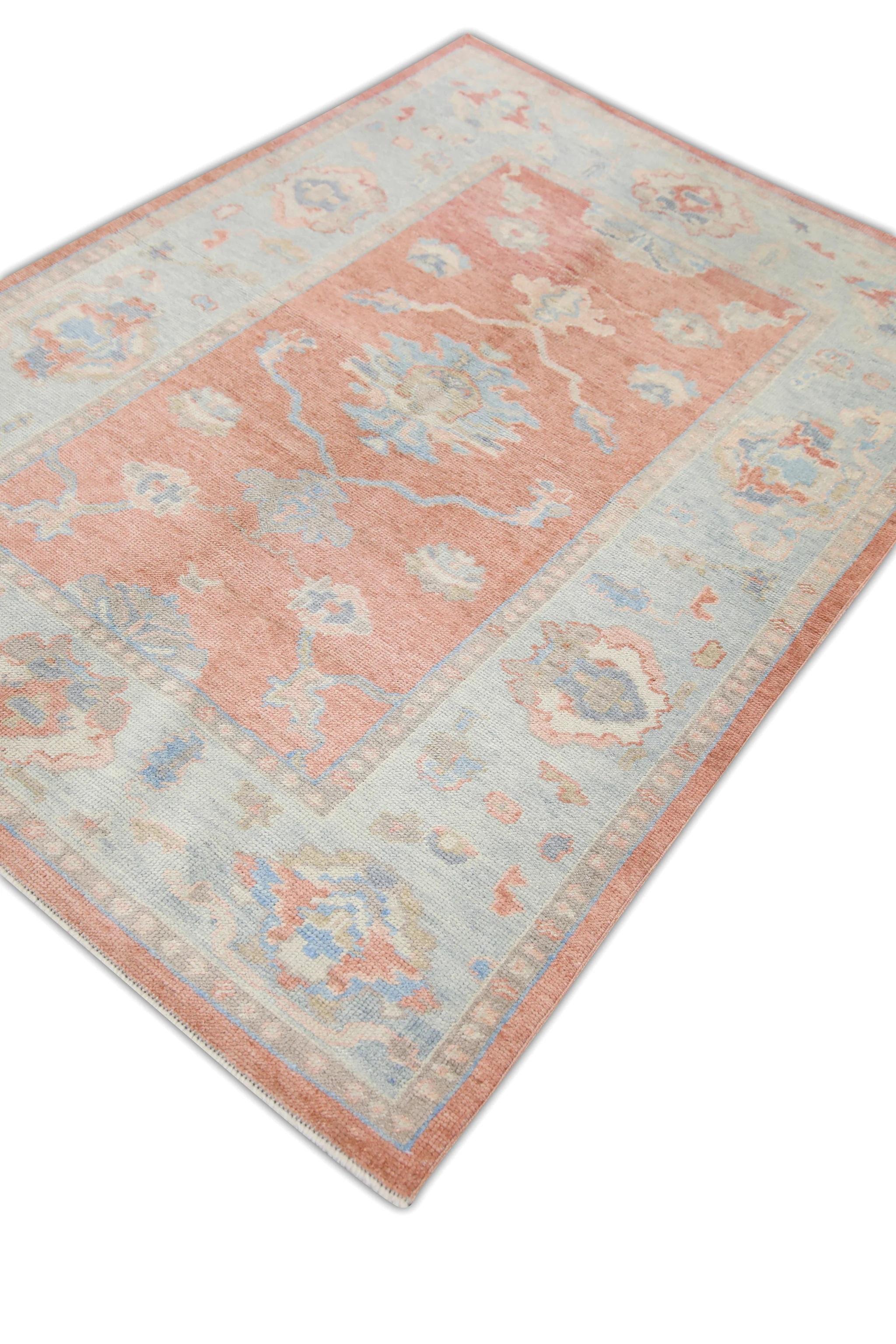 This Turkish oushak rug is a stunning piece of art that has been handwoven using traditional techniques by skilled artisans. The rug features intricate patterns and a soft color palette that is achieved through the use of natural vegetable