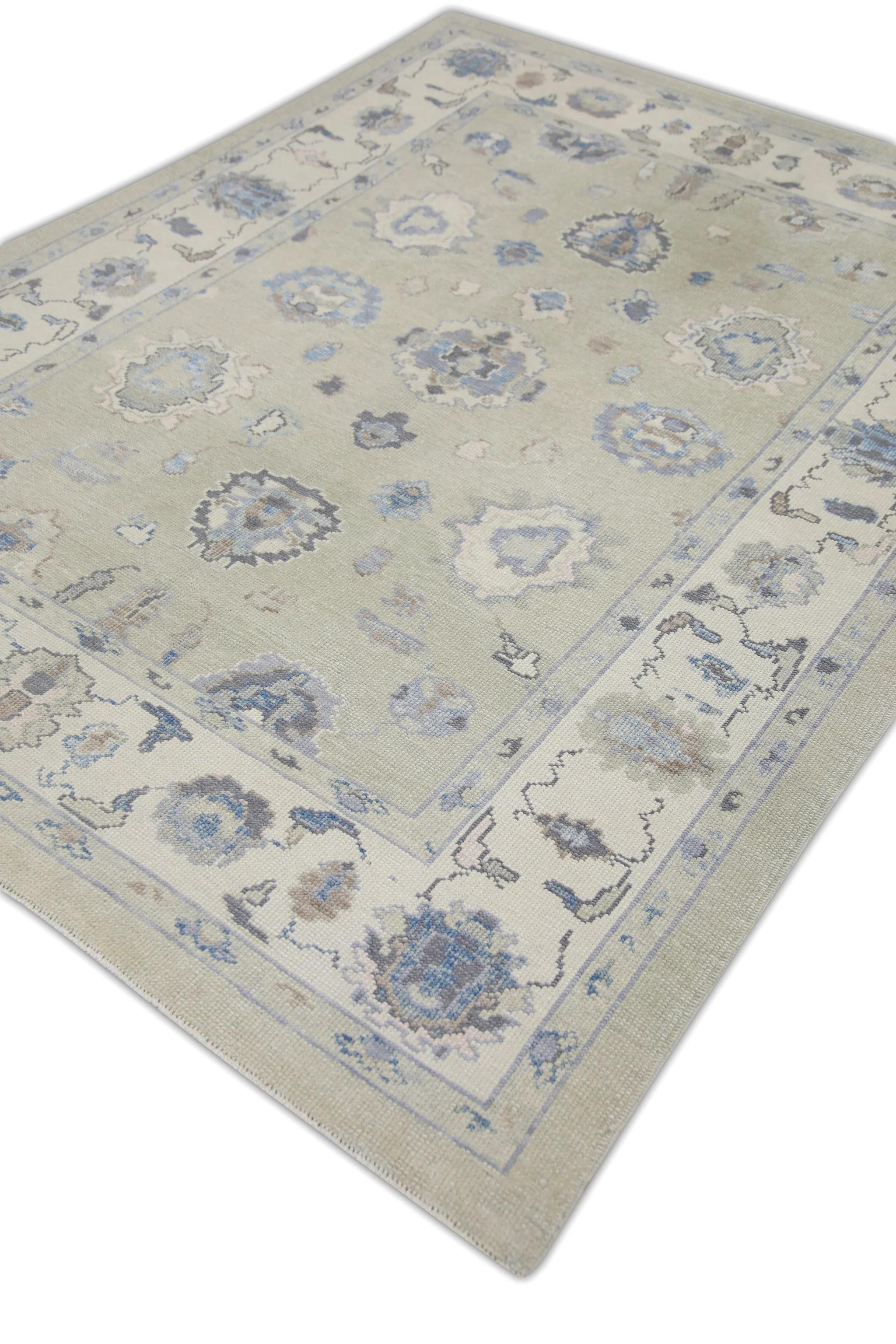 This modern Turkish Oushak rug is a stunning piece of art that has been handwoven using traditional techniques by skilled artisans. The rug features intricate patterns and a soft color palette that is achieved through the use of natural vegetable