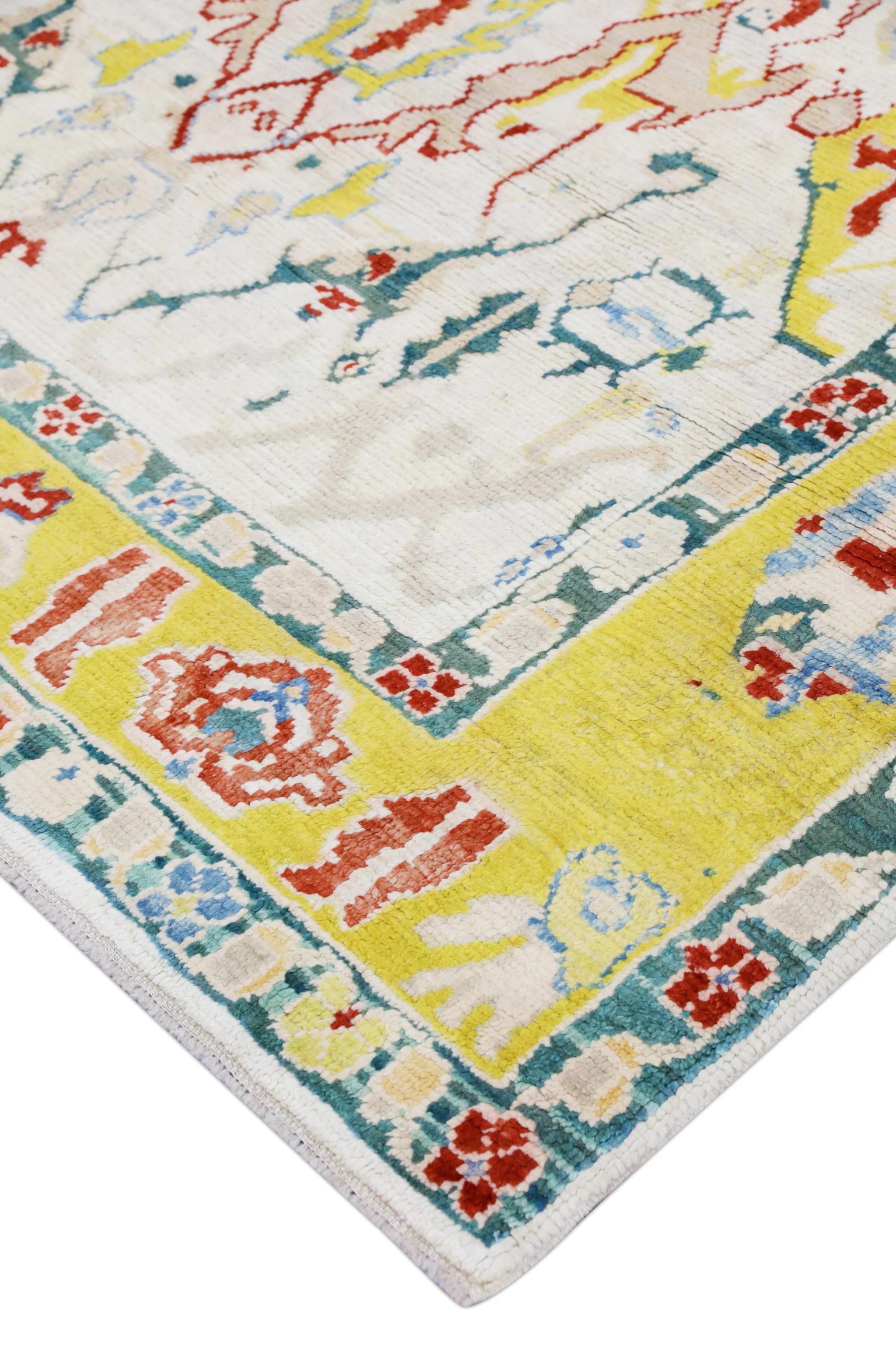 This modern Turkish Oushak rug is a stunning piece of art that has been handwoven using traditional techniques by skilled artisans. The rug features intricate patterns and a soft color palette that is achieved through the use of natural vegetable