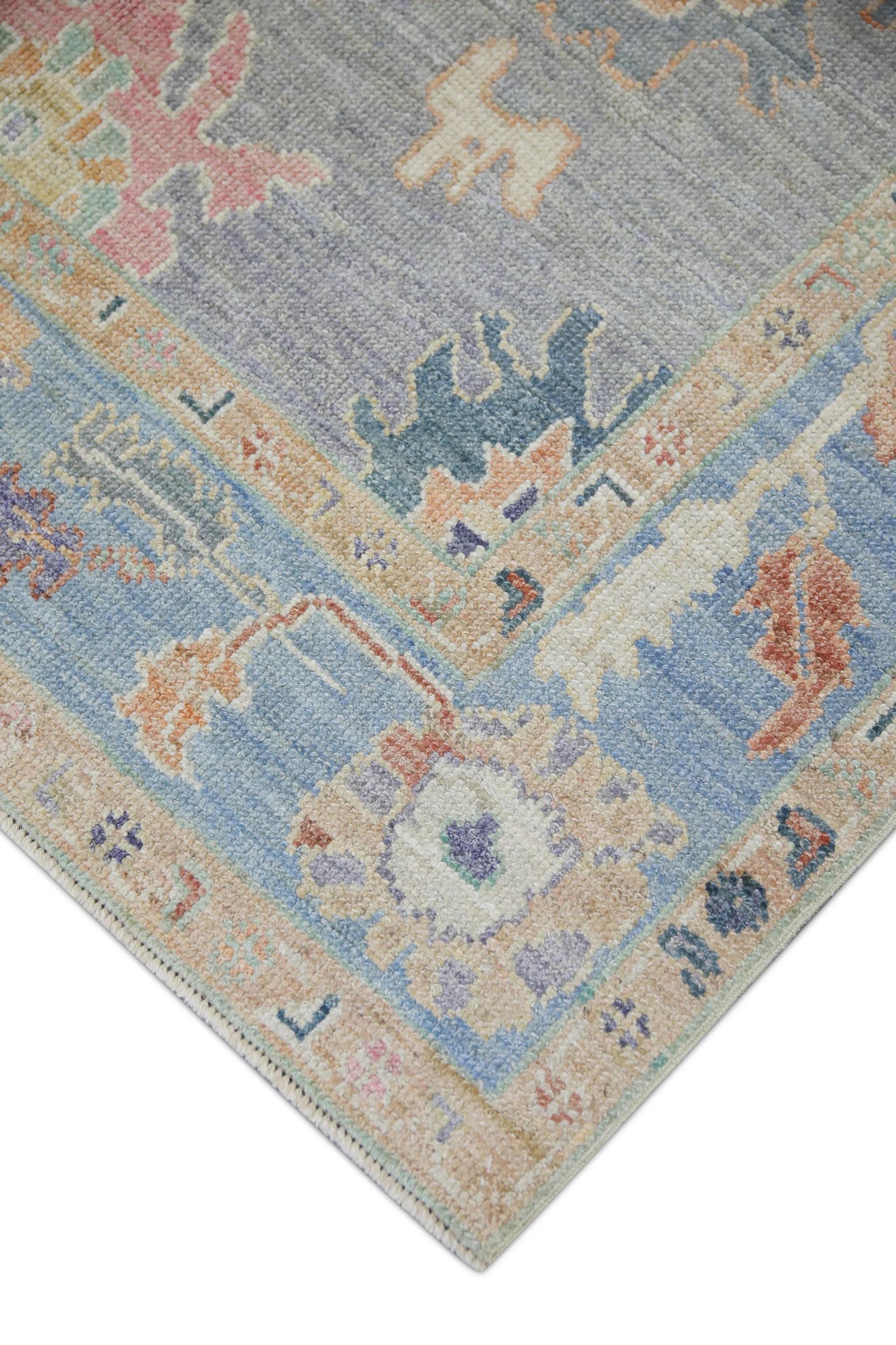 This modern Turkish Oushak rug is a stunning piece of art that has been handwoven using traditional techniques by skilled artisans. The rug features intricate patterns and a soft color palette that is achieved through the use of natural vegetable