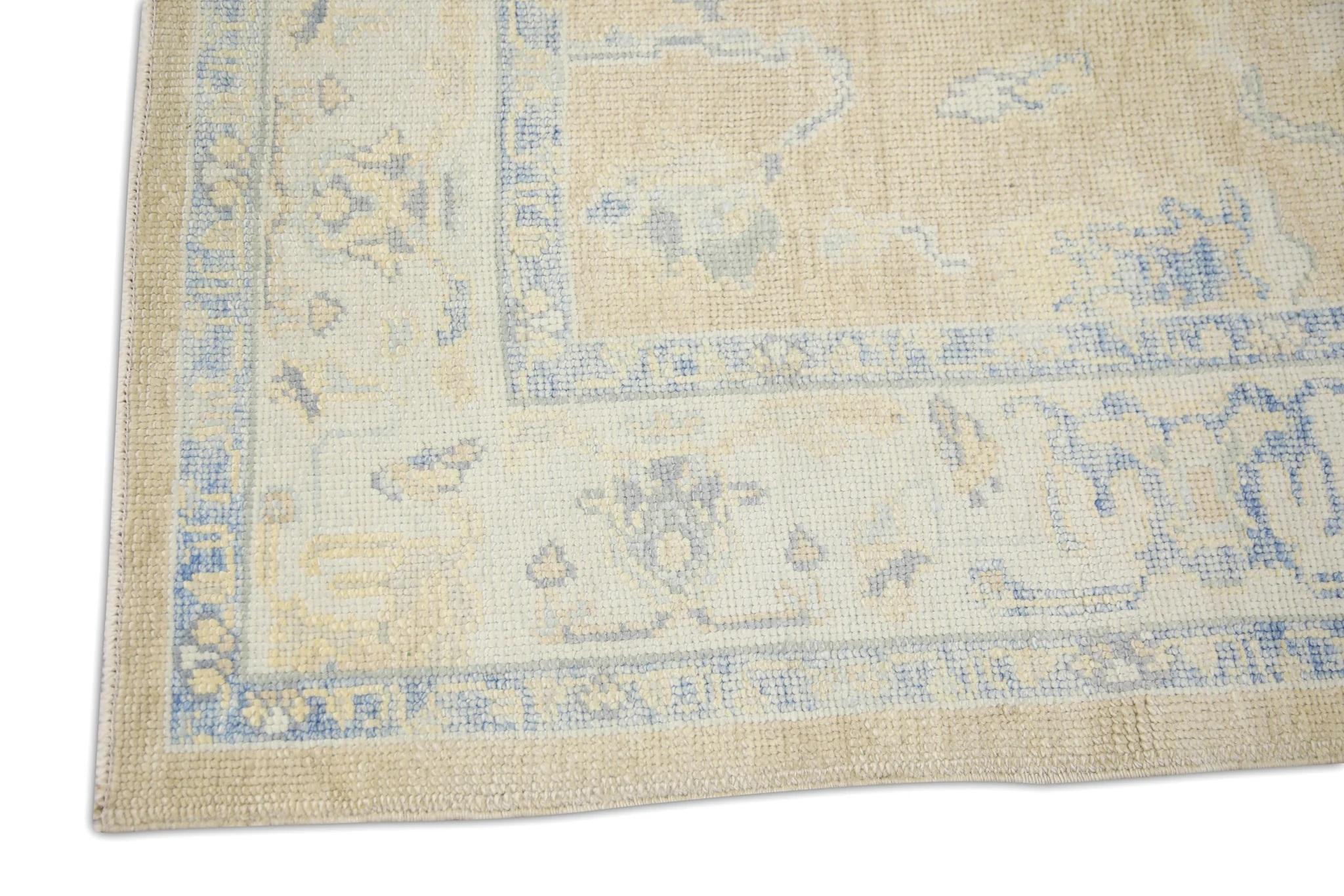 Vegetable Dyed Yellow Handwoven Wool Turkish Oushak Rug with Blue Floral Pattern 5' x 7' For Sale