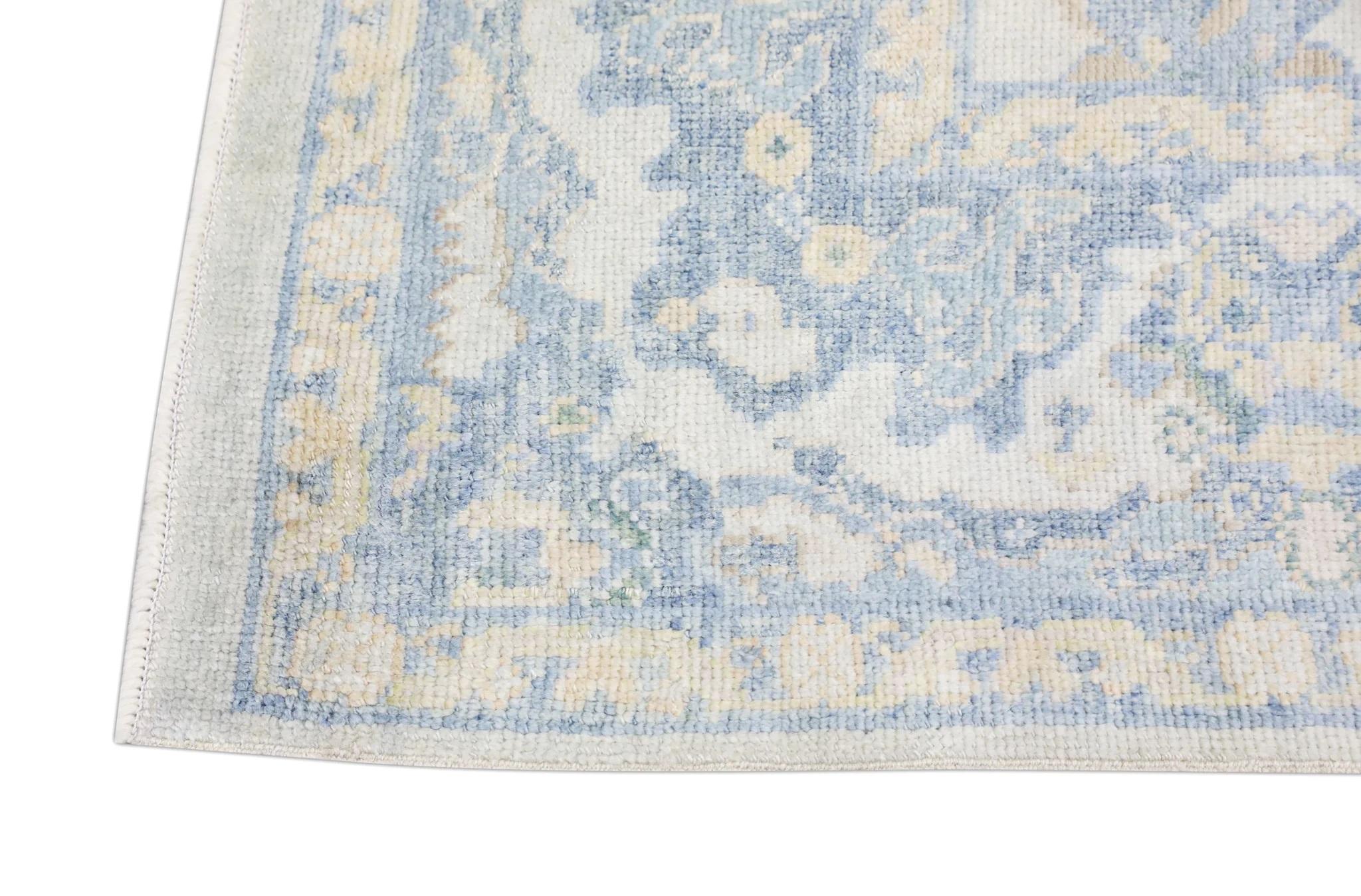 Contemporary Soft Blue Handwoven Wool Turkish Oushak Rug with Floral Design 5' x 8'2
