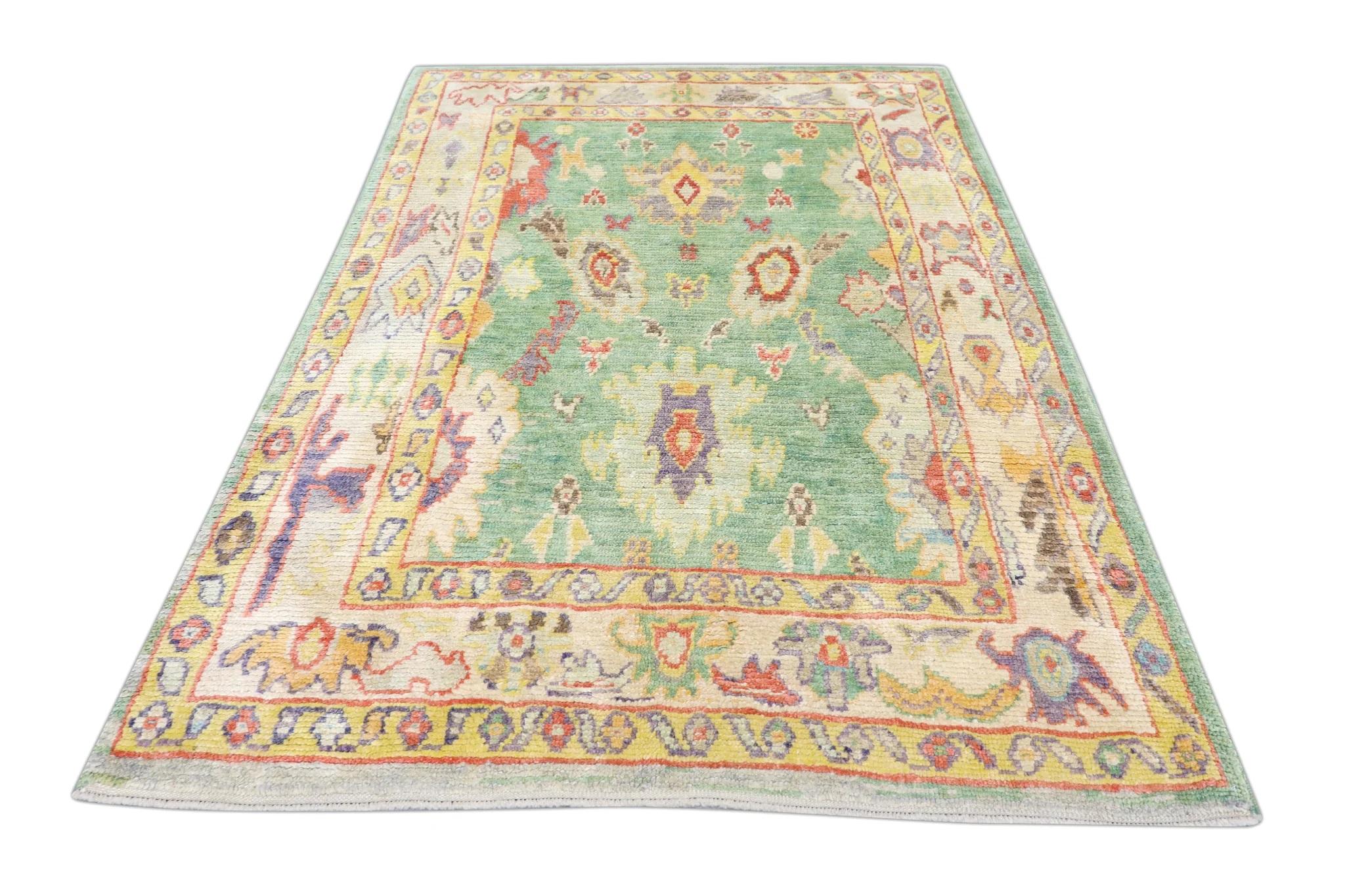 Green Handwoven Wool Turkish Oushak Rug with Colorful Floral Pattern 5'4