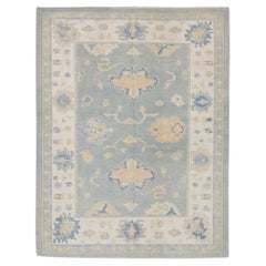 Handgewebter türkischer Oushak-Teppich aus Wolle in Blau & Apricot-Blumenmuster 7' x 9'5"