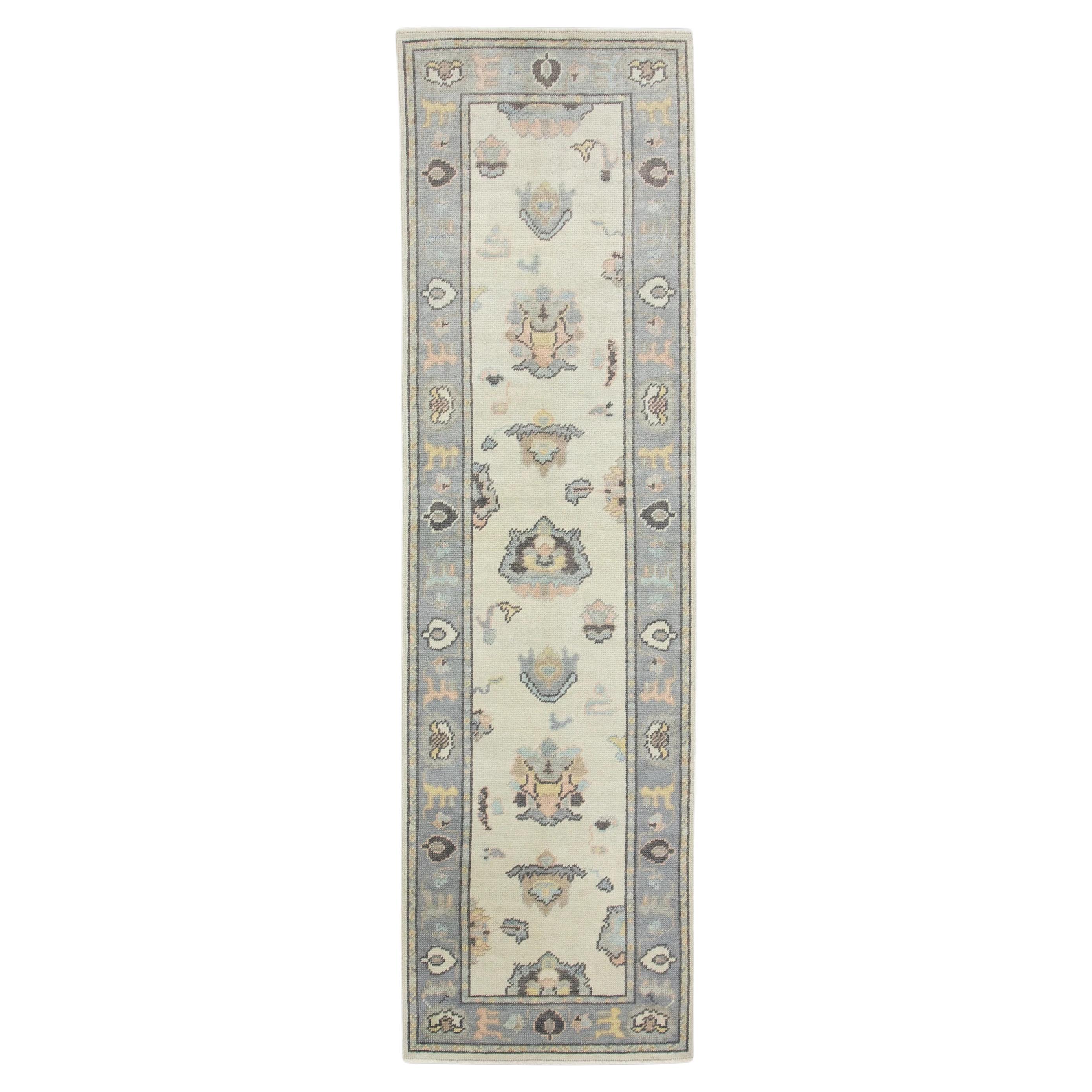 Cream Handwoven Wool Turkish Oushak Rug in Multicolor Floral Design 2'6" x 8'7" For Sale