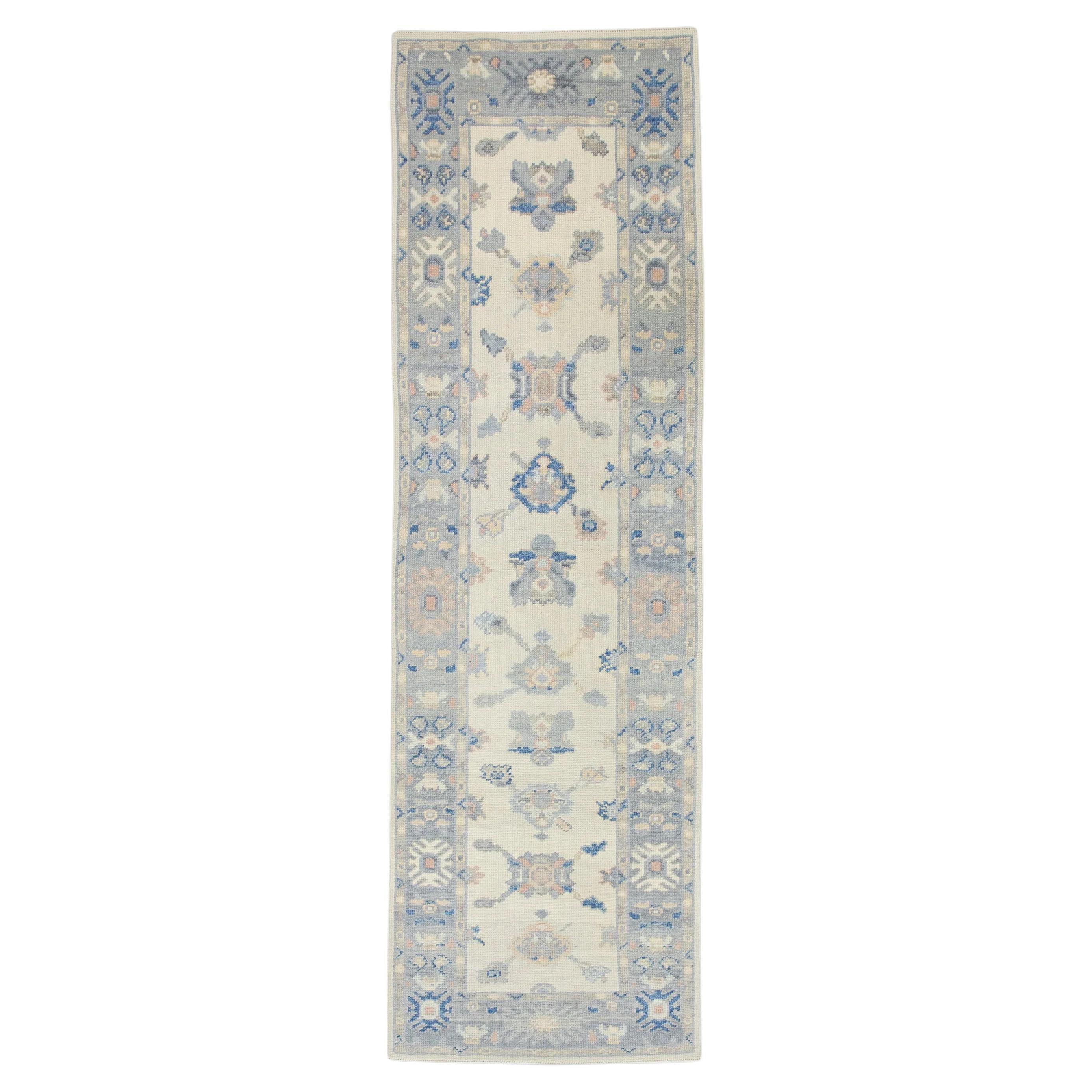 Cream Handwoven Wool Turkish Oushak Rug in Blue Floral Pattern 2'6" x 8'4" For Sale