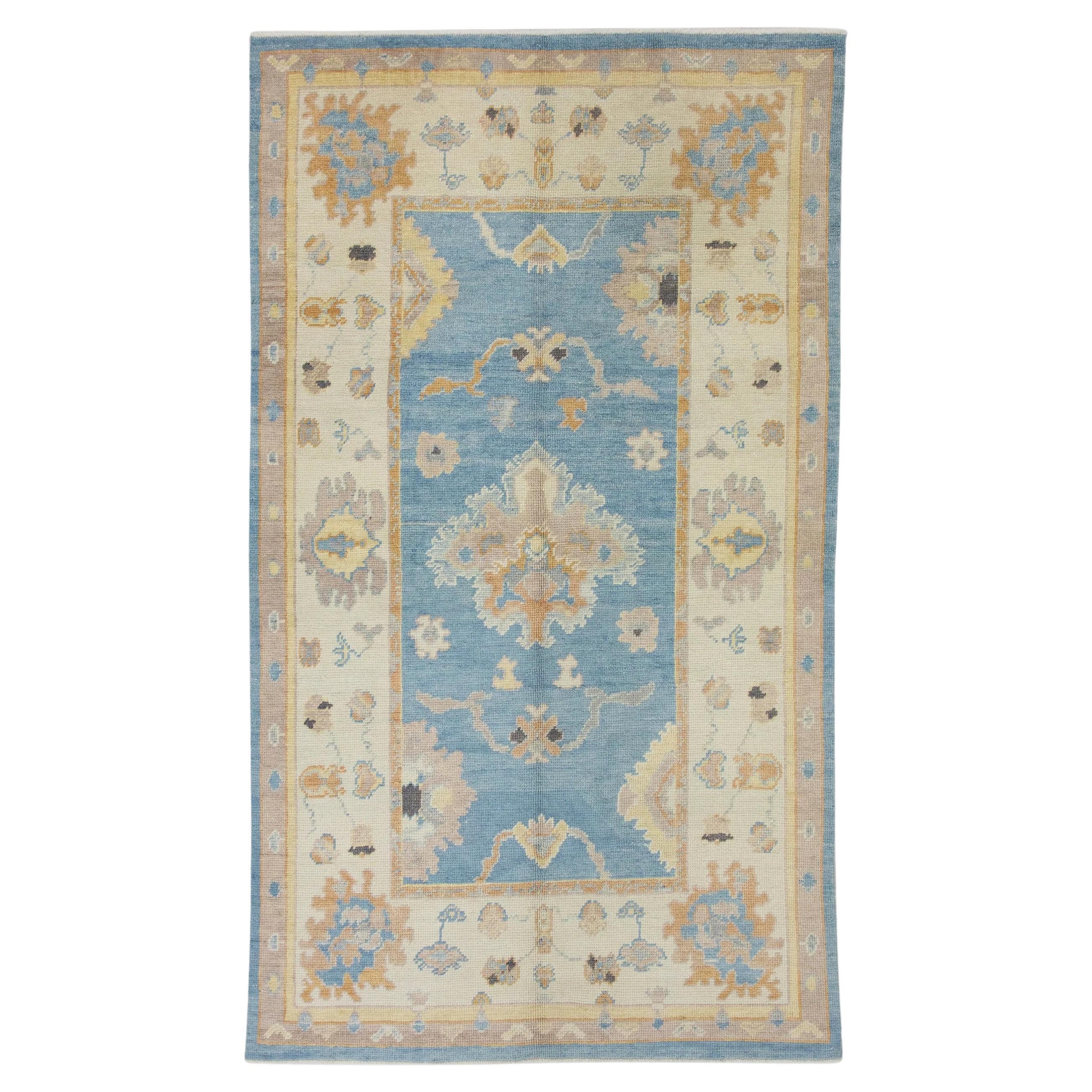 Blue and Orange Handwoven Wool Floral Turkish Oushak Rug 4'8" x 8'1" For Sale