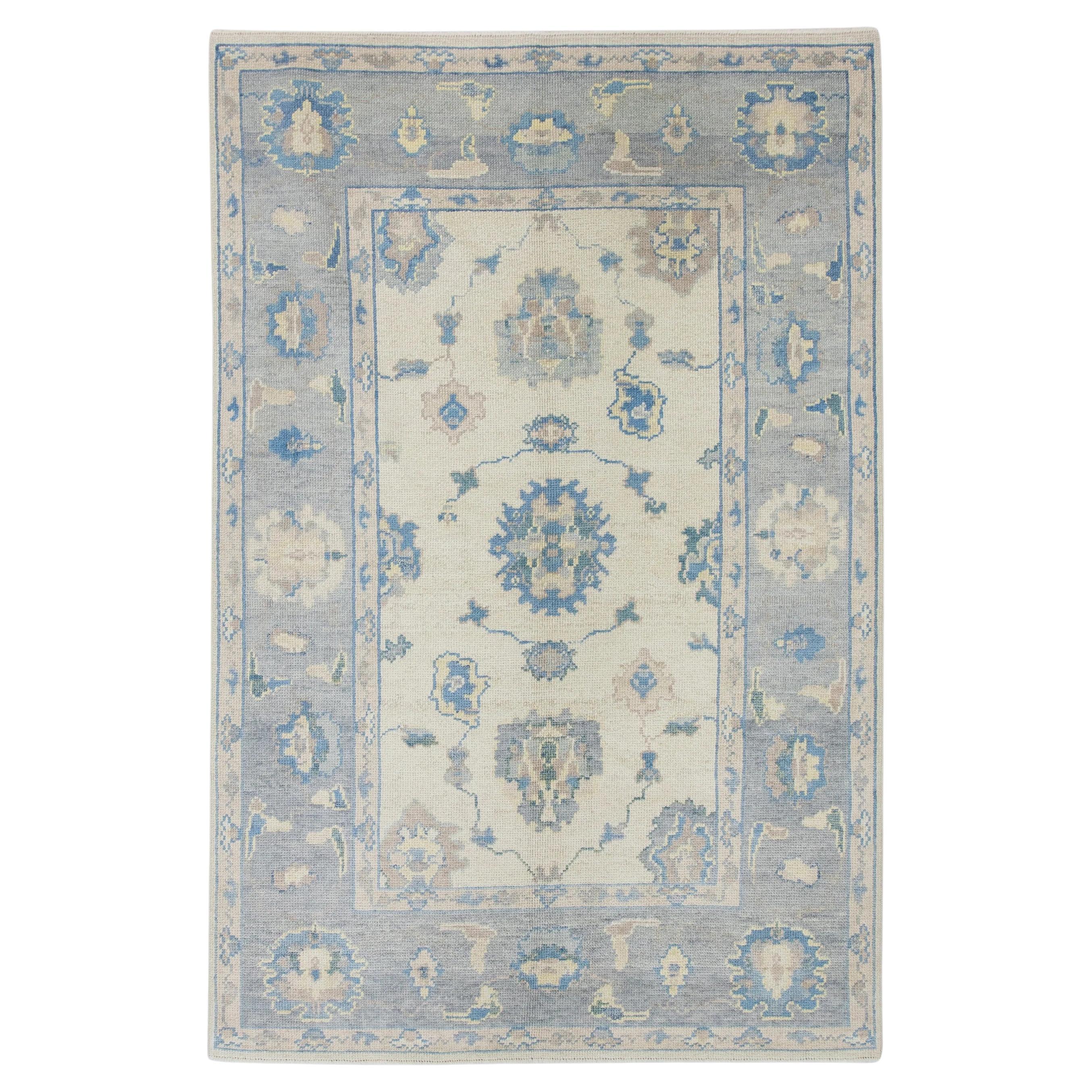 Blue Floral Handwoven Wool Turkish Oushak Rug 4'10" x 7'7" For Sale