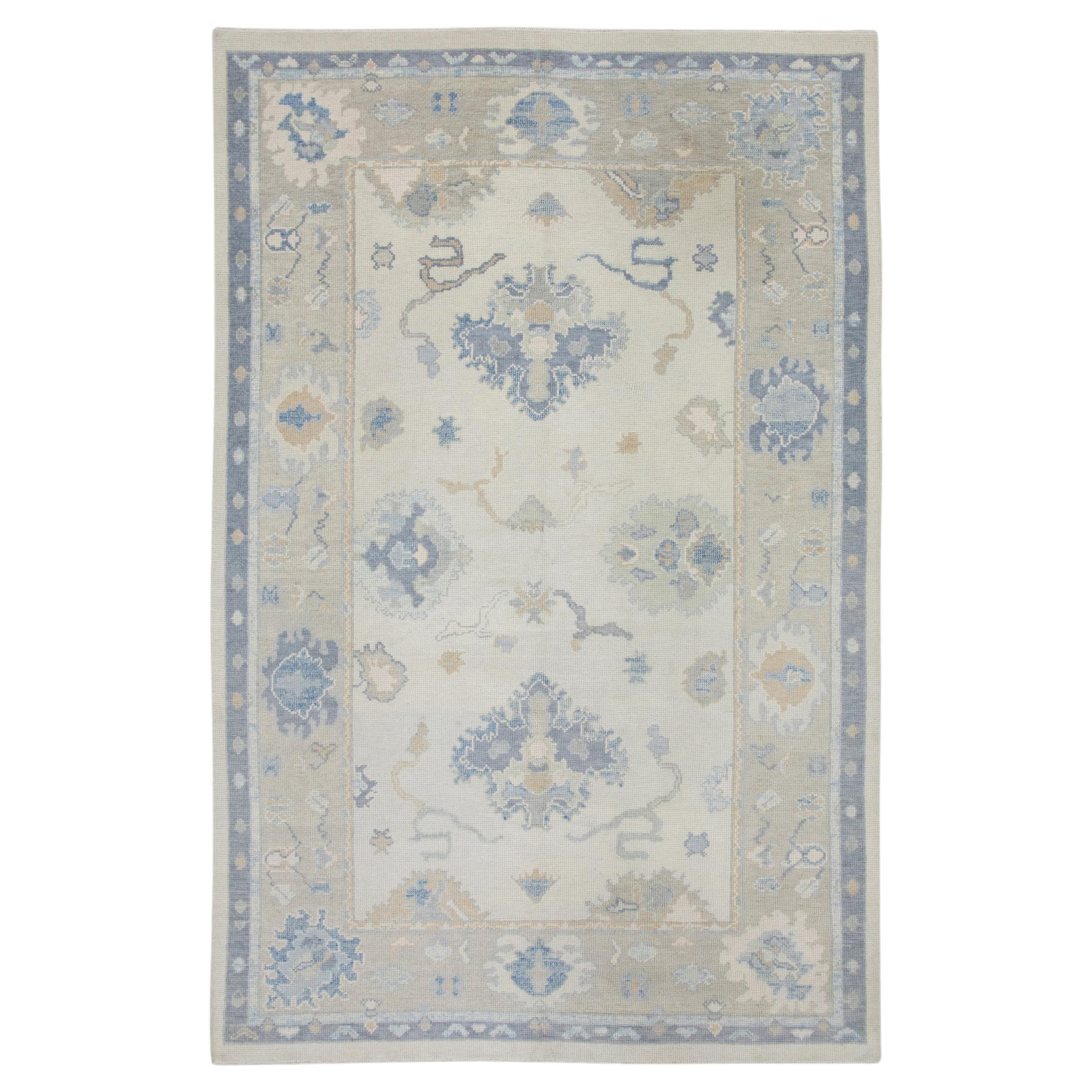Taupe and Blue Floral Handwoven Wool Turkish Oushak Rug 6' x 8'9" For Sale