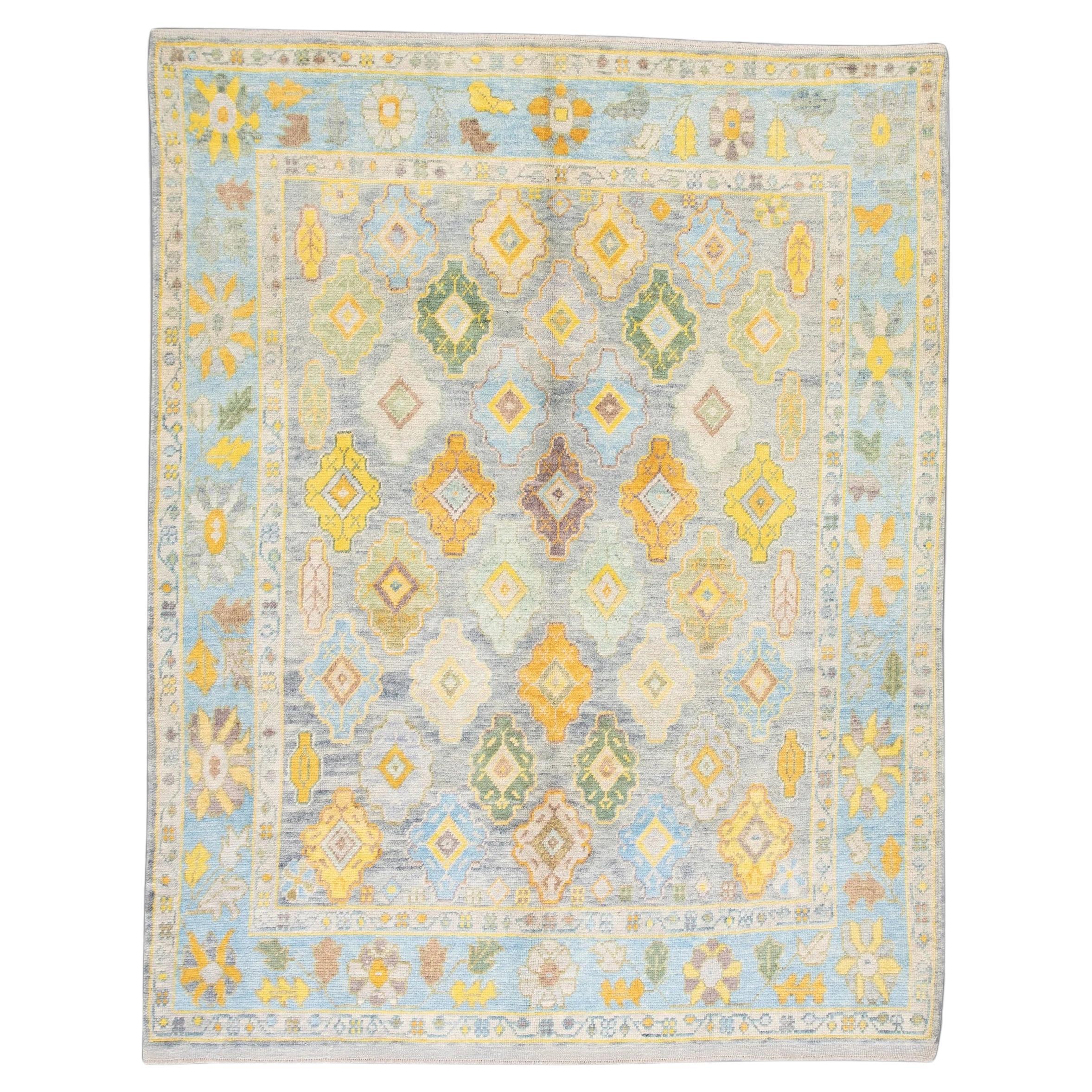 Handwoven Wool Floral Turkish Oushak Rug in Blue, Green, and Yellow 8'1" x 9'10" For Sale