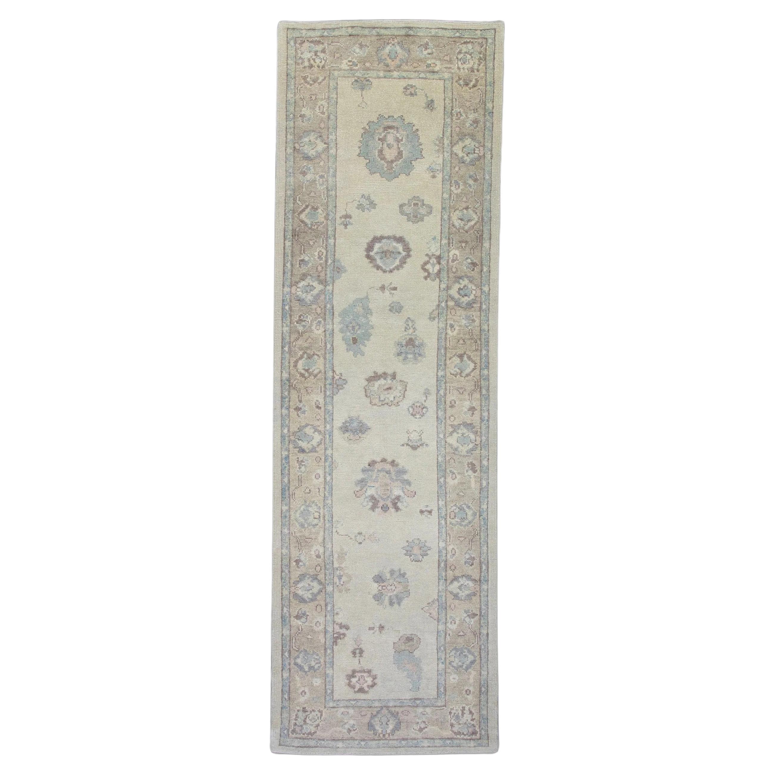 Cream, Blue, and Purple Floral Handwoven Wool Turkish Oushak Rug 3'2" x 9'7" For Sale