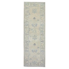 Floral Handwoven Wool Turkish Oushak Rug in Cream and Soft Blue 3'2" x 9'9"