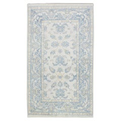 Soft Blue Handwoven Wool Turkish Oushak Rug with Floral Design 5' x 8'2"