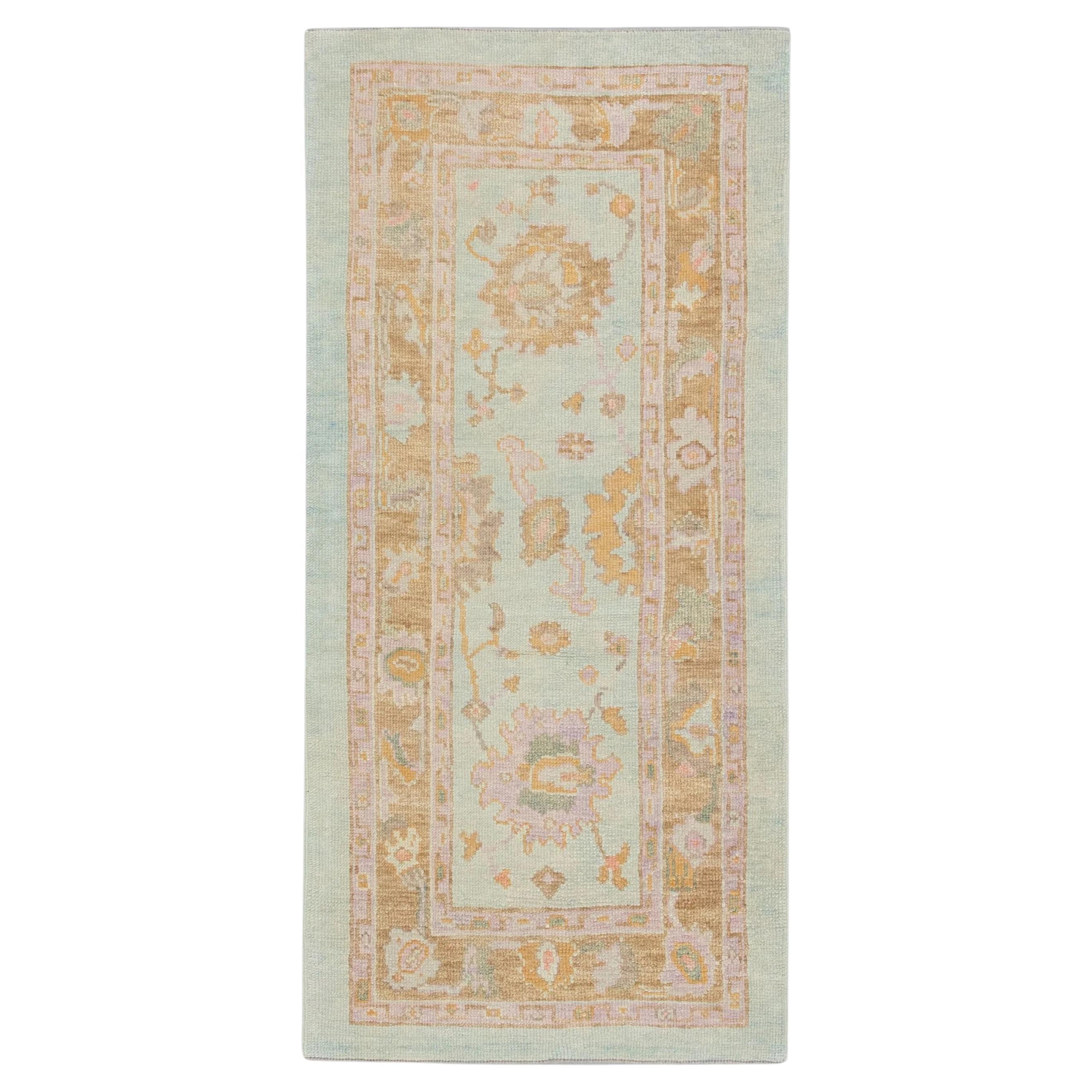 Soft Blue Handwoven Wool Turkish Oushak Rug with Colorful Floral Design 3' x 6'3 For Sale
