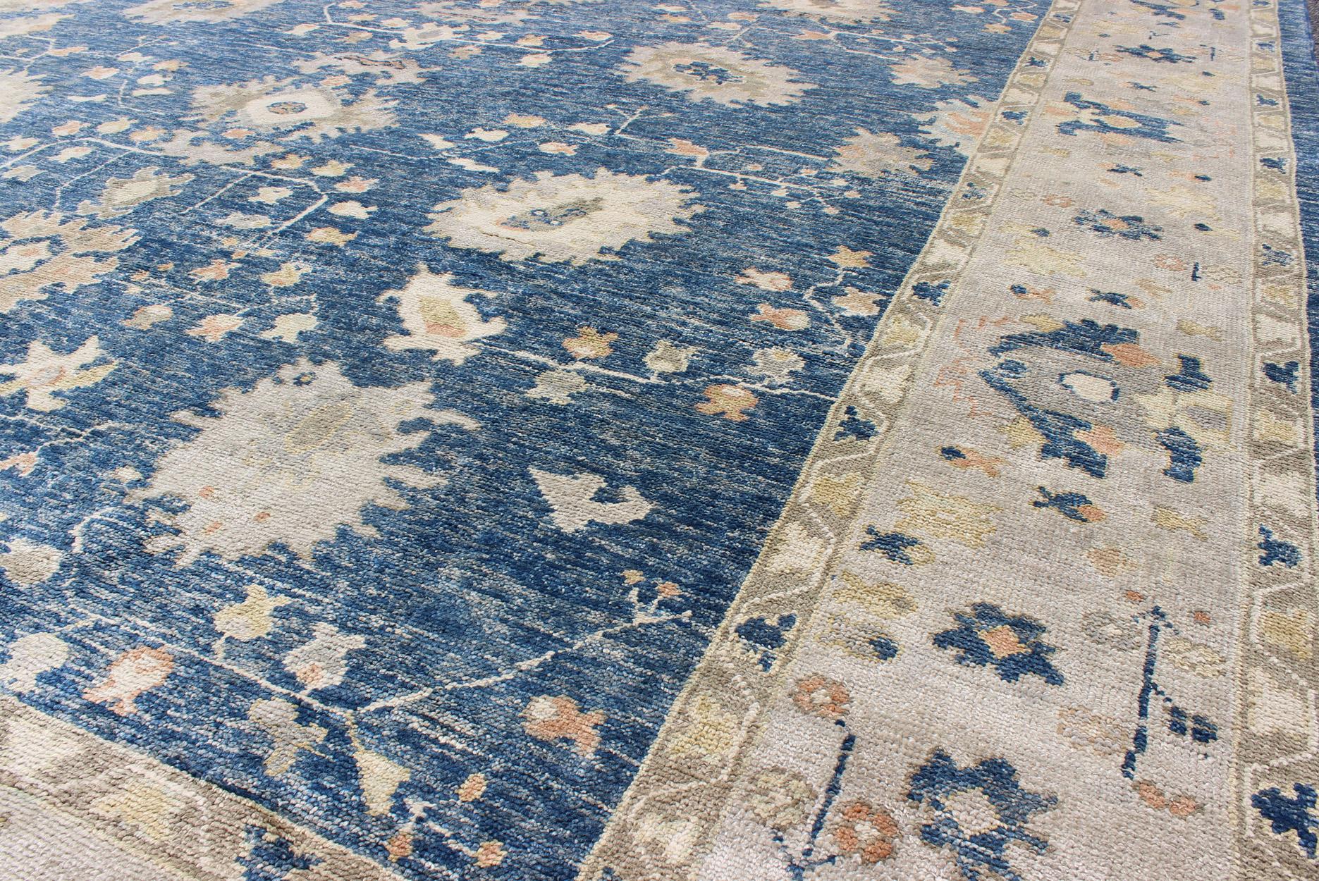 Contemporary Turkish Oushak Rug in Blue Background, Neutral Colors and All-Over Design For Sale