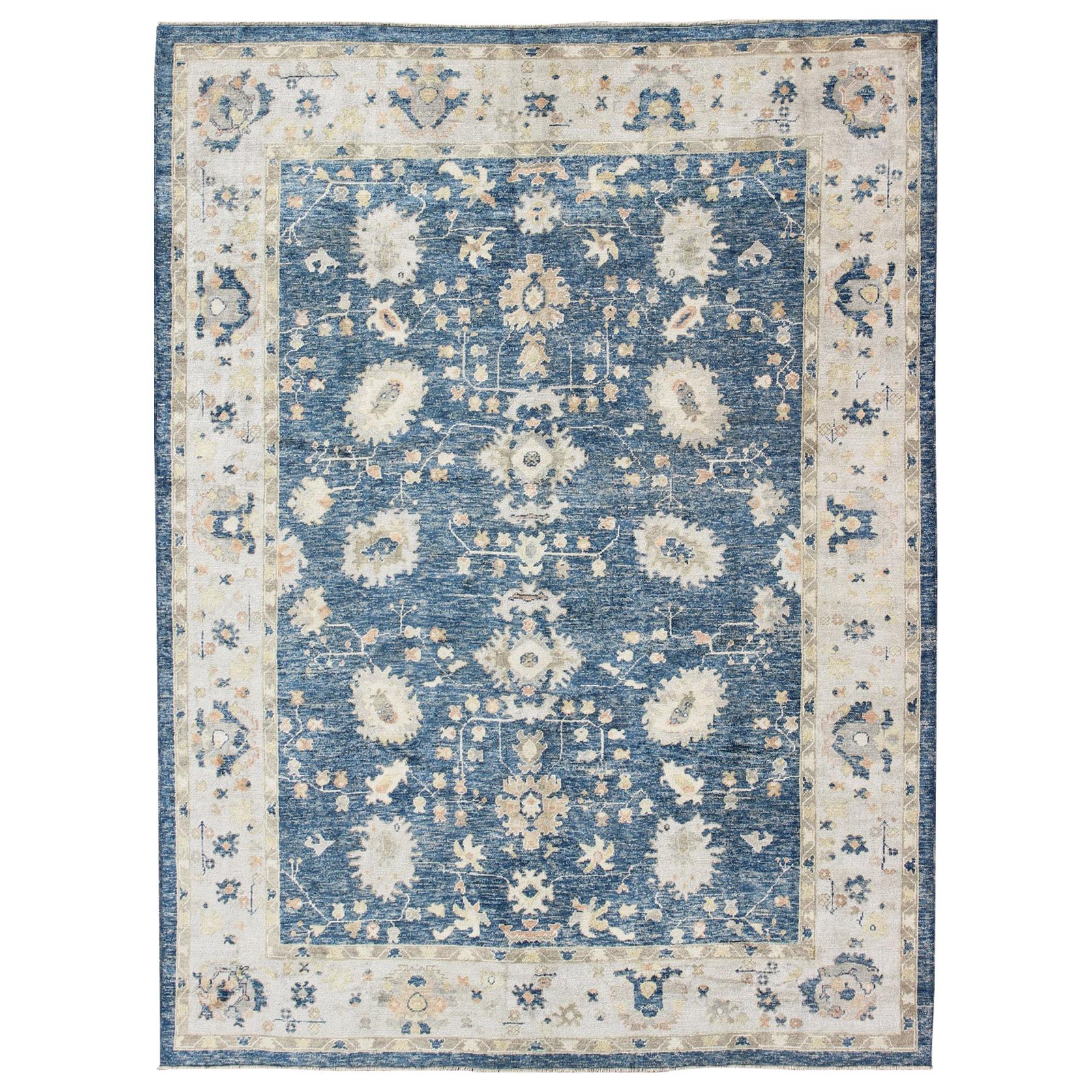 Turkish Oushak Rug in Blue Background, Neutral Colors and All-Over Design For Sale