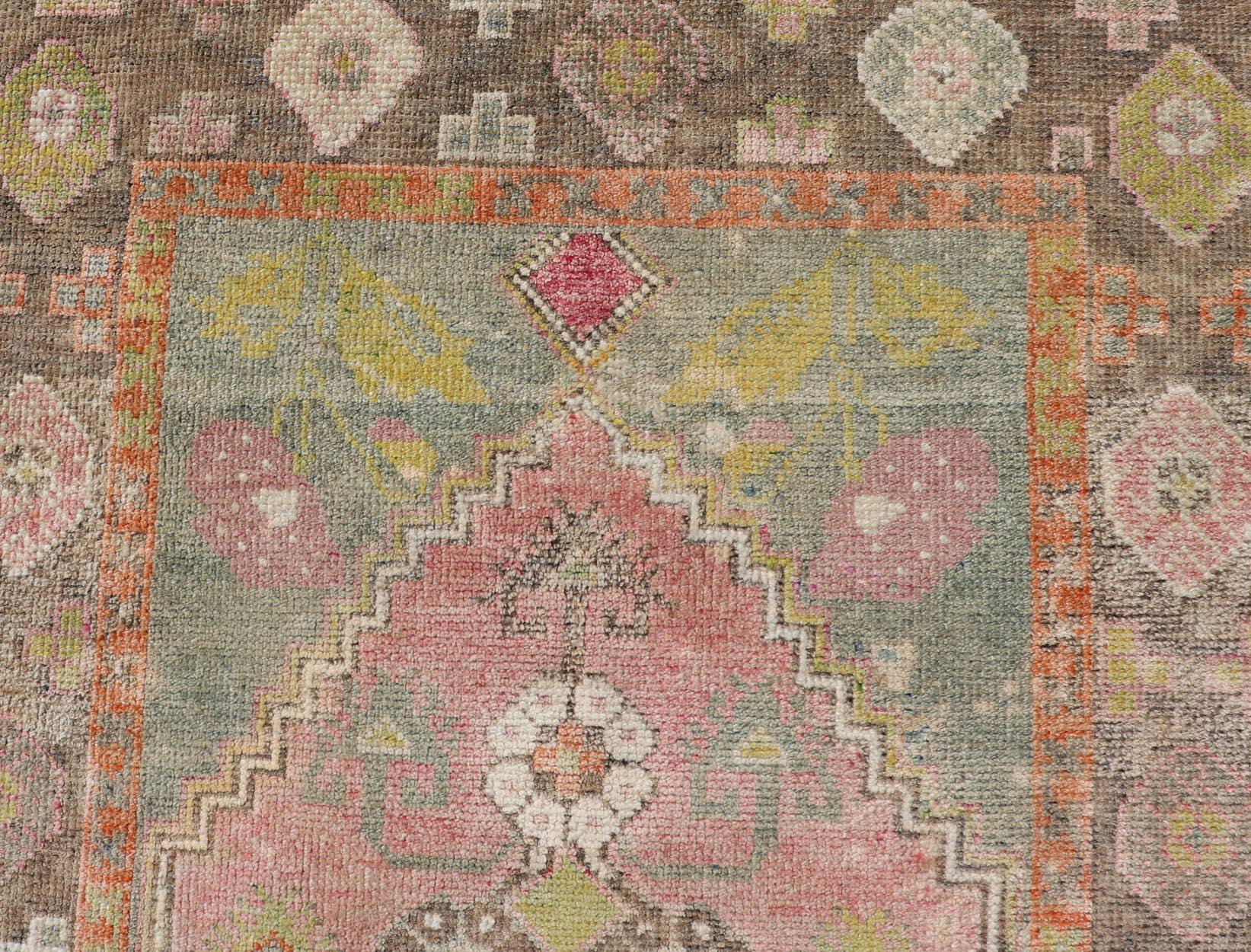 Measures: 3'5 x 5'8 Turkish Oushak Rug -Pastel Pink, Green, and Yellow Floral Medallions. Keivan Woven Arts / Rug / EN-14880 Country of origin / type: Turkey / Oushak delightful Vintage Turkish Oushak rug features a harmonious blend of pastel pink,