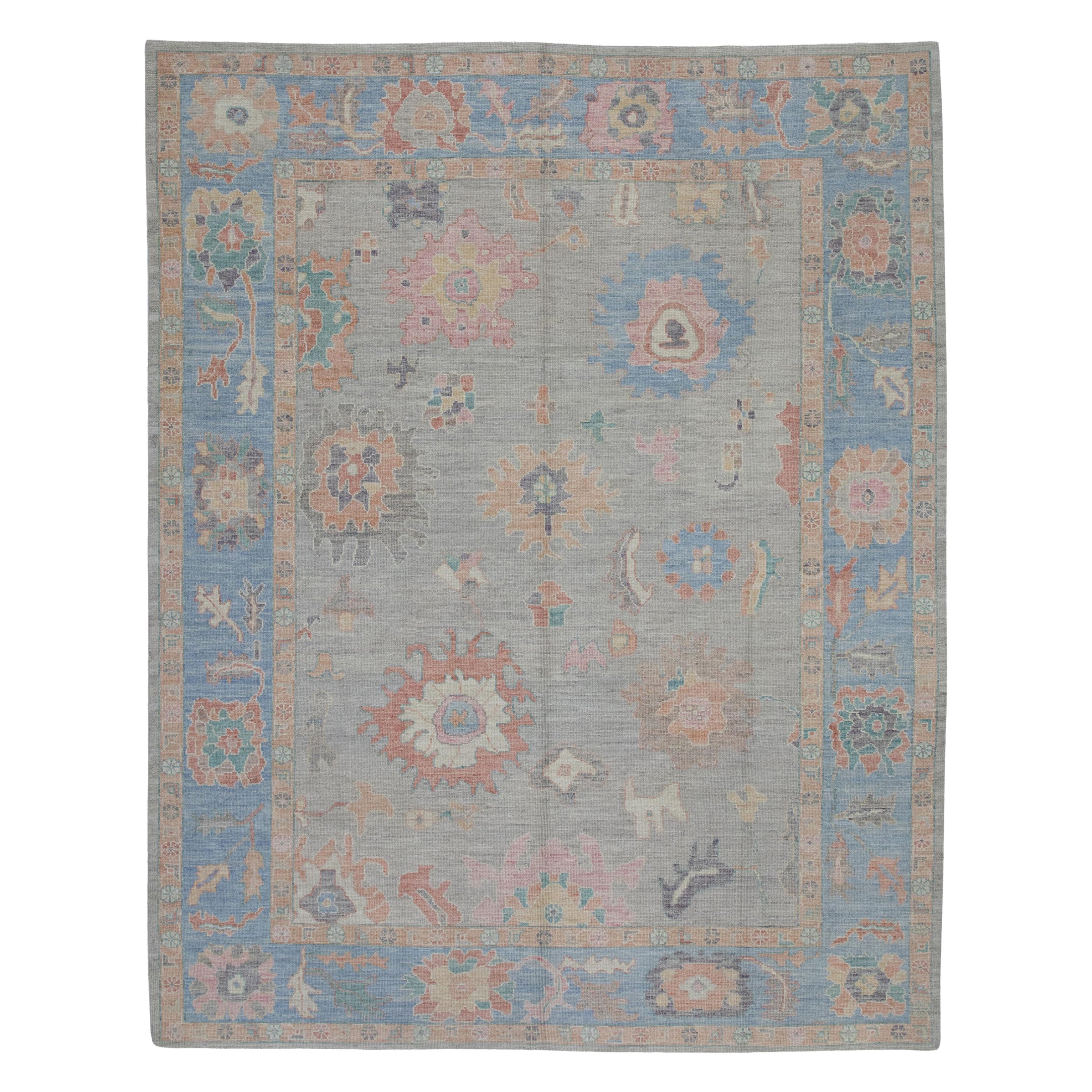 Türkischer Oushak-Teppich aus handgewebter Wolle in Rosa und Blau mit Blumenmuster 9'6" x 11'10" im Angebot