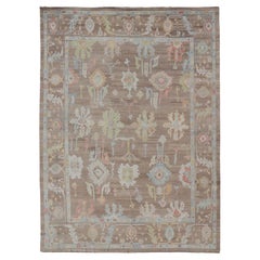 Turkish Oushak Rug with All-Over Floral Design On A Light Brown Field 