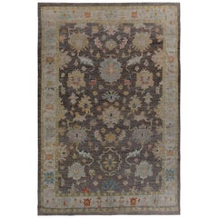 Turkish Oushak Rug with Blue and Gold Floral Details on Brown and Ivory Field