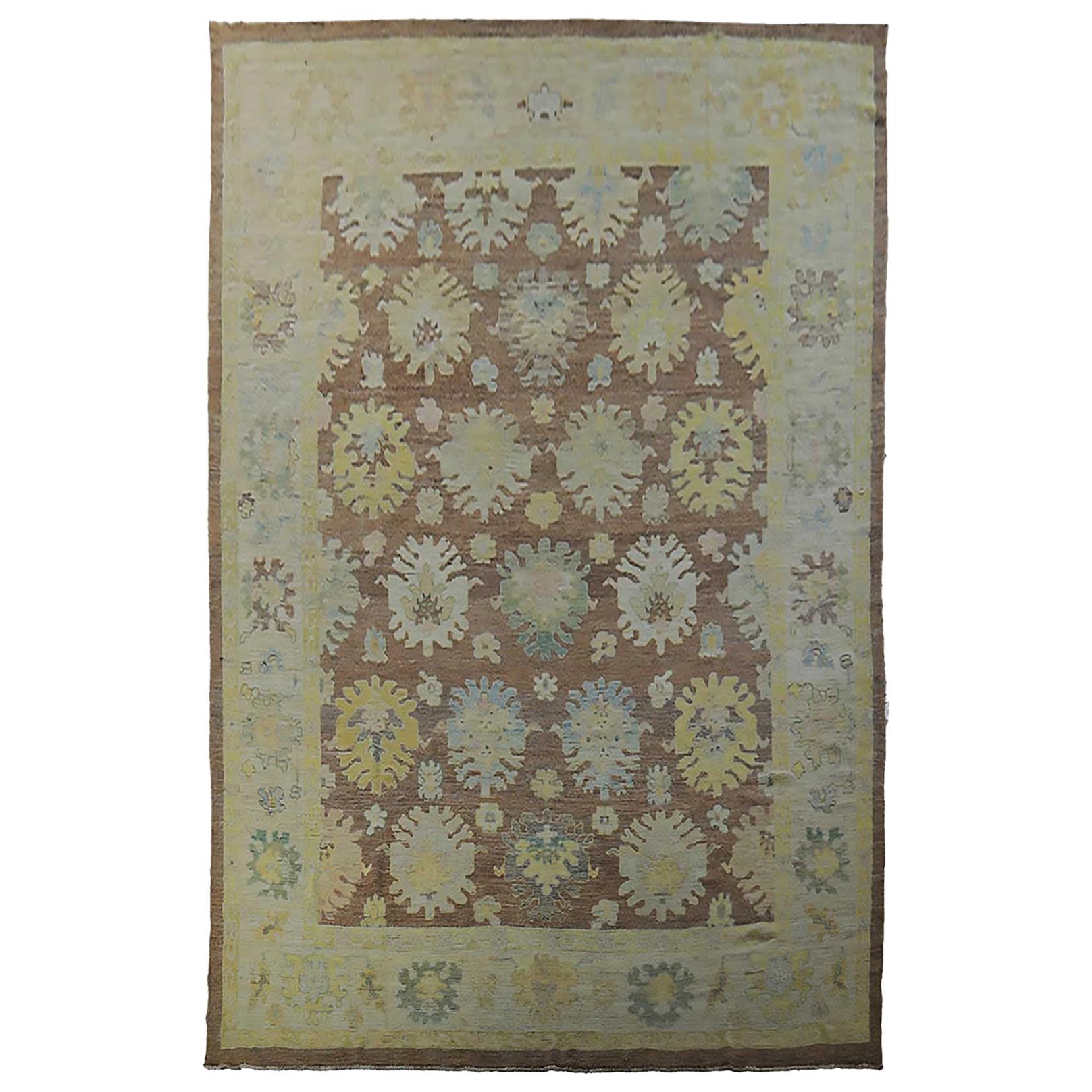 Turkish Oushak Rug with Blue and Gold Floral Details on Dark Brown Field For Sale