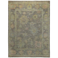 Turkish Oushak Rug with Blue and Pink Floral Heads on Brown Field