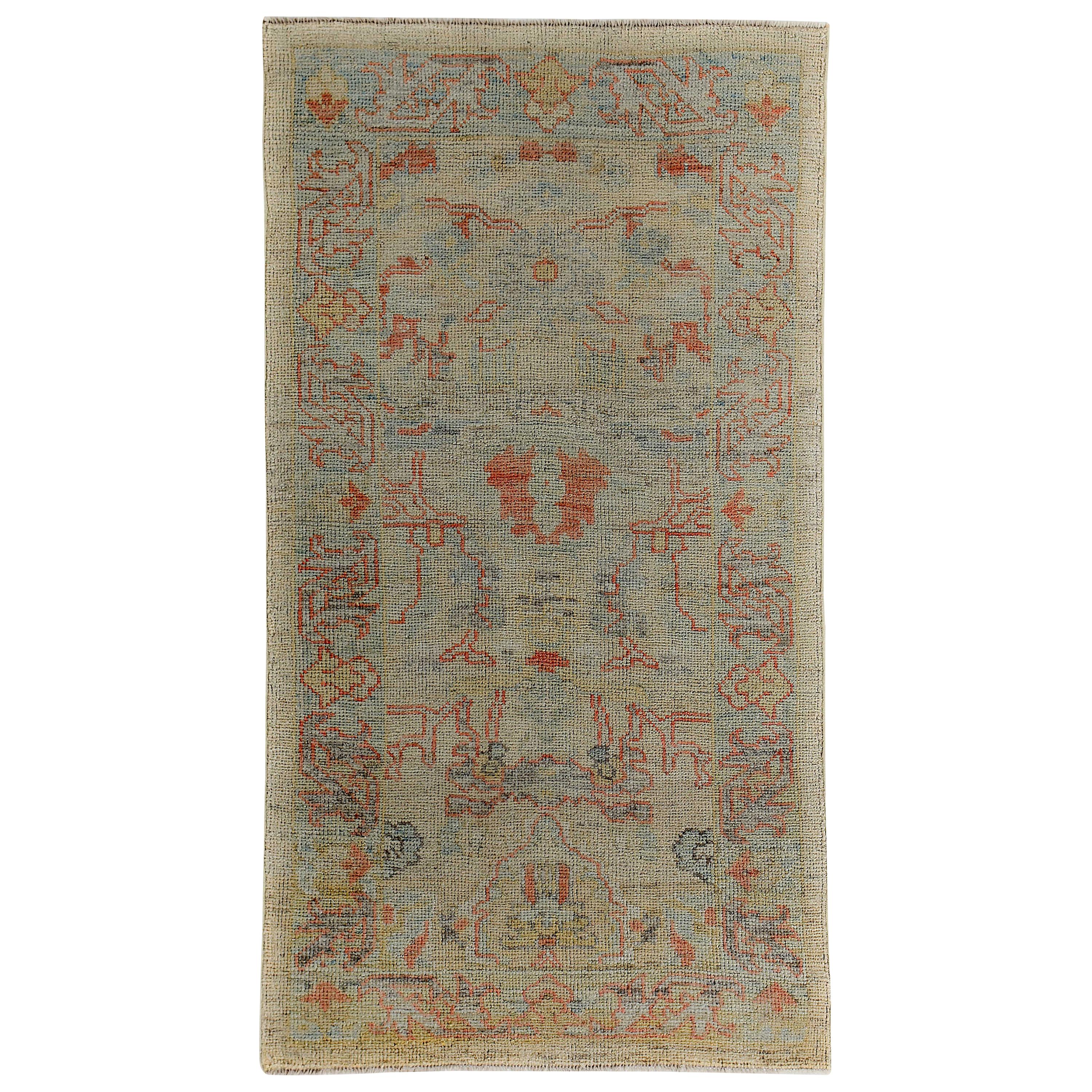 Turkish Oushak Rug with Blue and Rust Floral Details on Ivory Field For Sale
