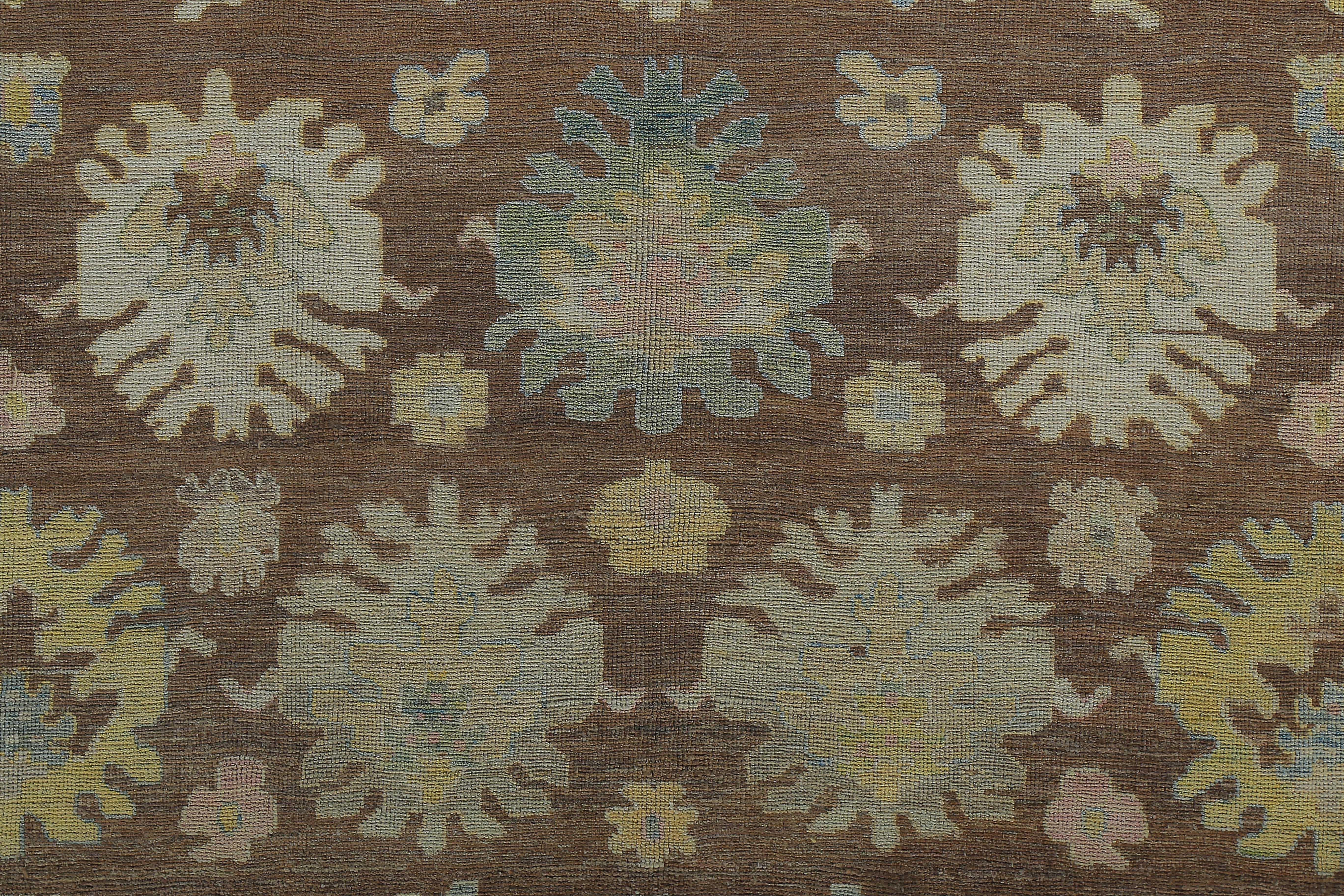 Hand-Woven Turkish Oushak Rug with Blue and Gold Floral Details on Dark Brown Field For Sale