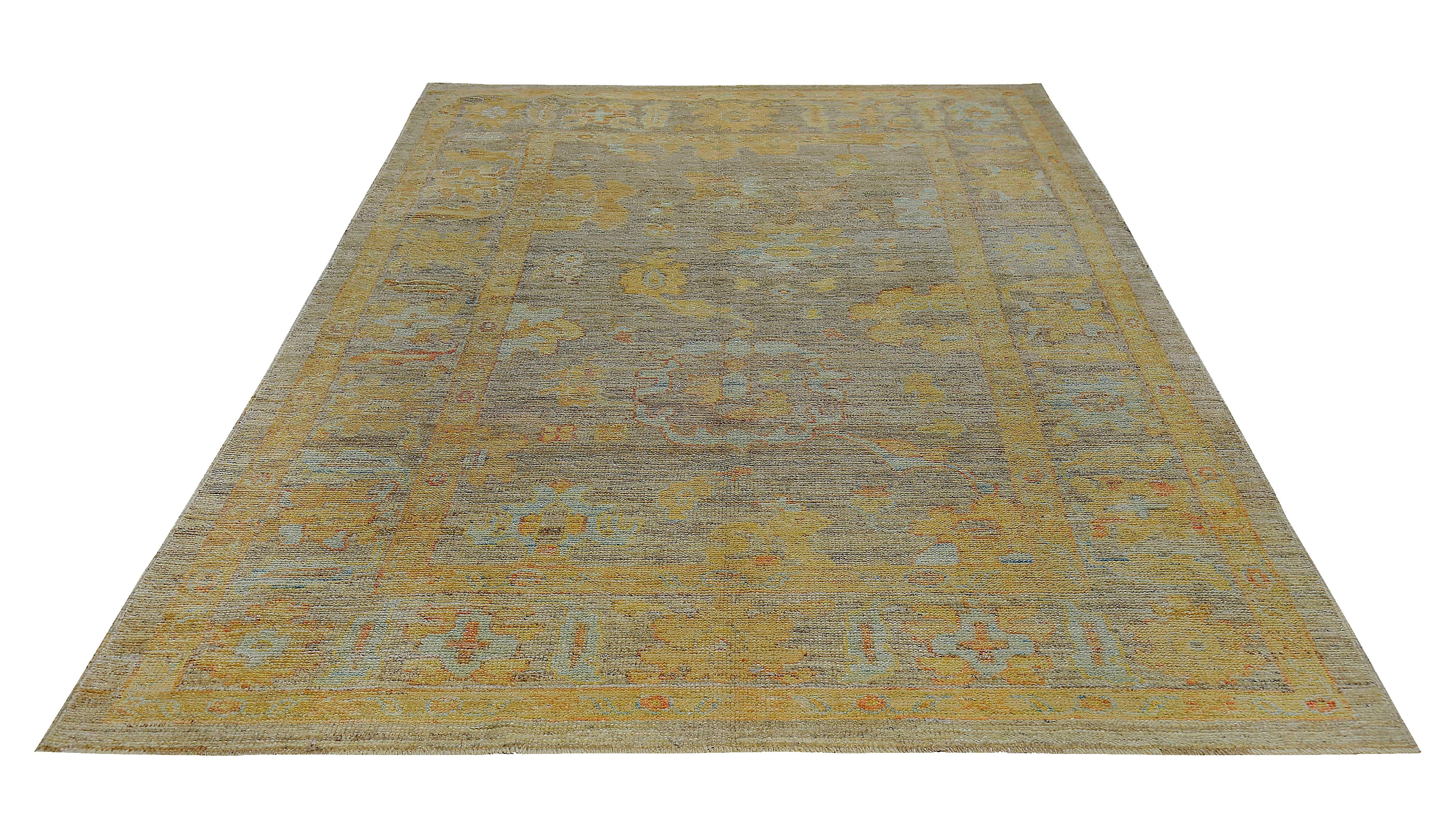 New Turkish rug made of handwoven sheep’s wool of the finest quality. It’s colored with organic vegetable dyes that are certified safe for humans and pets alike. It features blue and gold floral patterns on a fine ivory and brown field. Flower