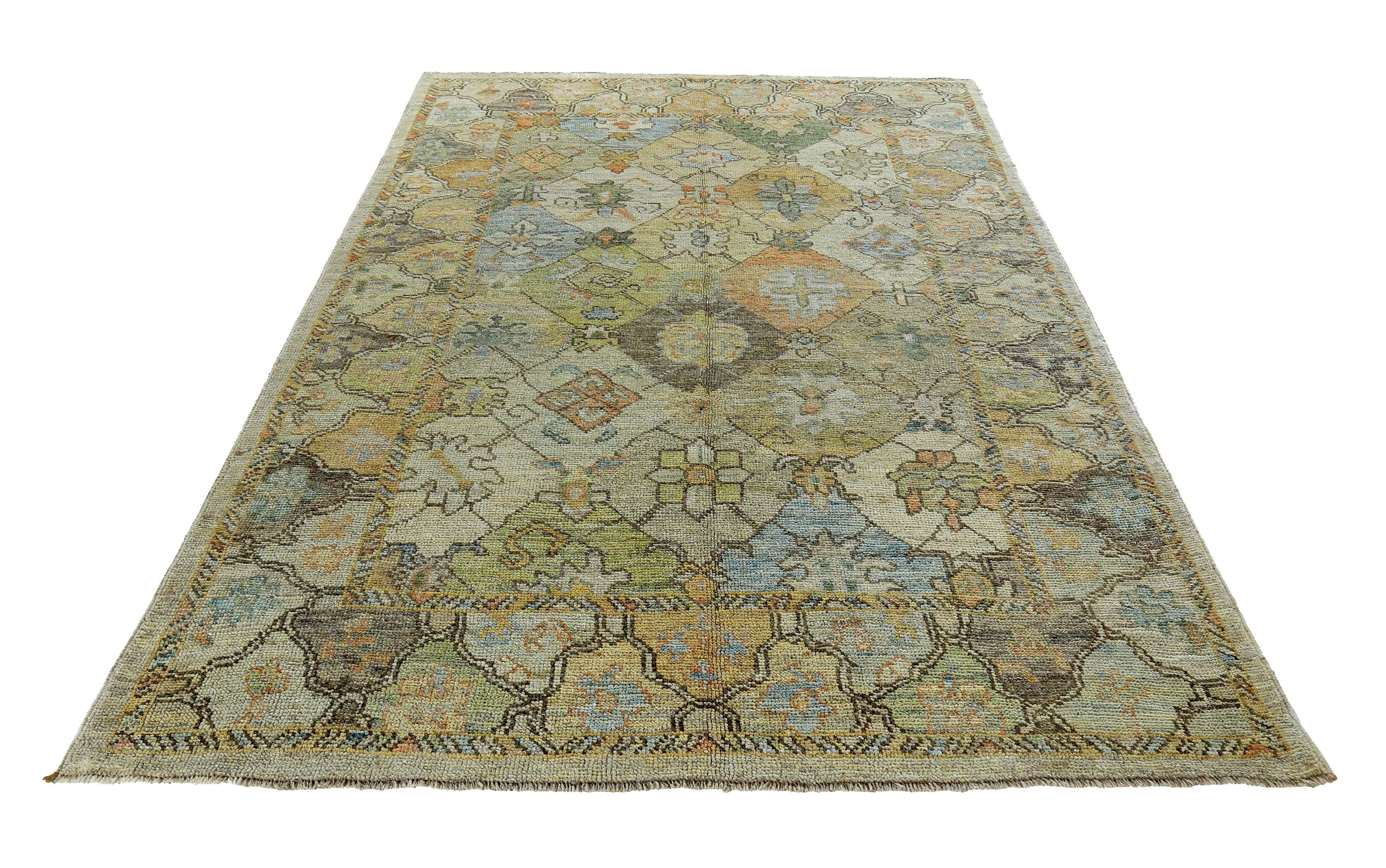 Turkish rug made of handwoven sheep’s wool of the finest quality. It’s colored with organic vegetable dyes that are certified safe for humans and pets alike. It features blue and green floral patterns on a beautiful ivory field. Flower patterns are