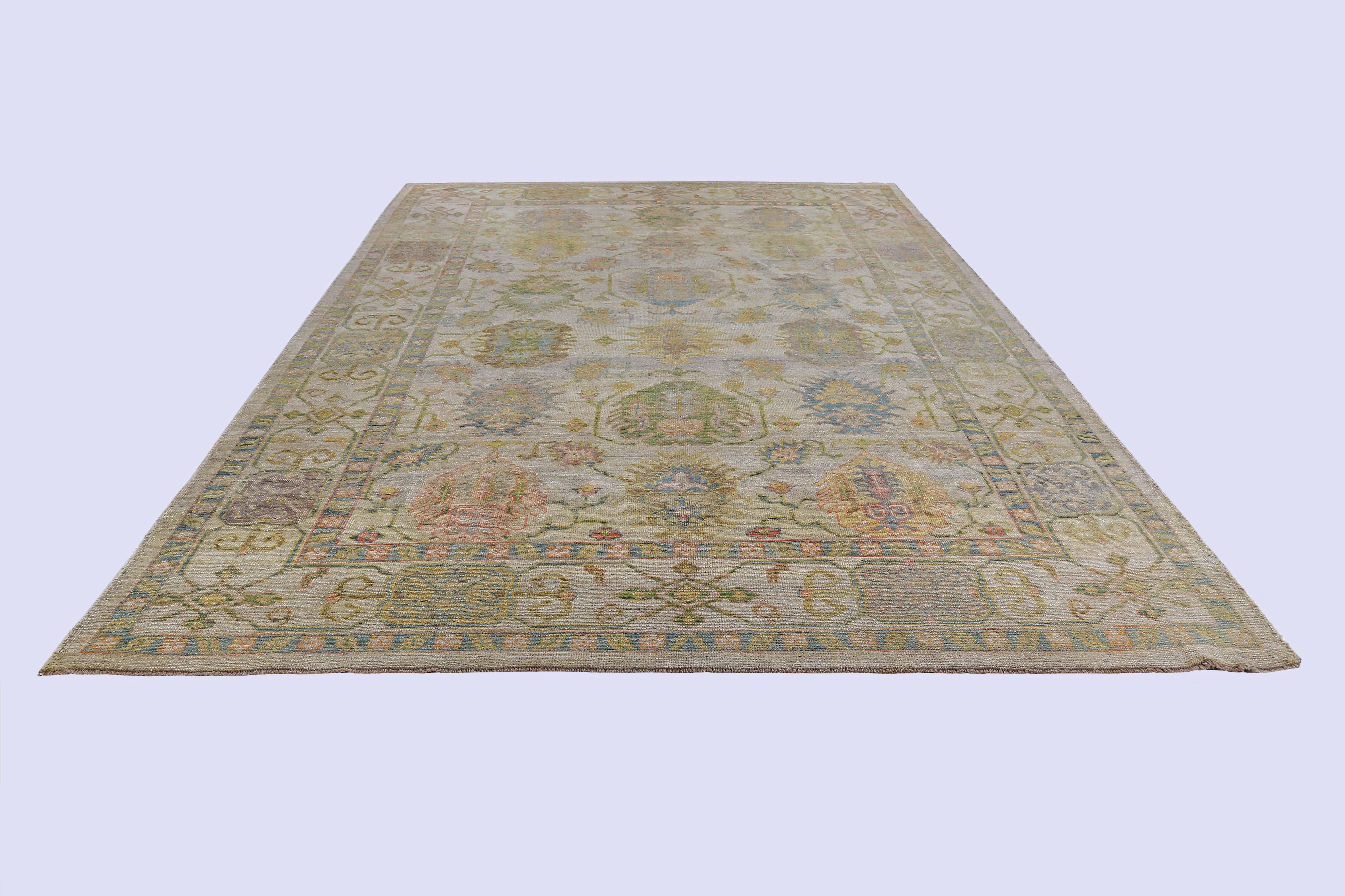 Turkish rug made of handwoven sheep’s wool of the finest quality. It’s colored with organic vegetable dyes that are certified safe for humans and pets alike. It features blue orange and green flower heads on a beautiful beige field. Flower patterns