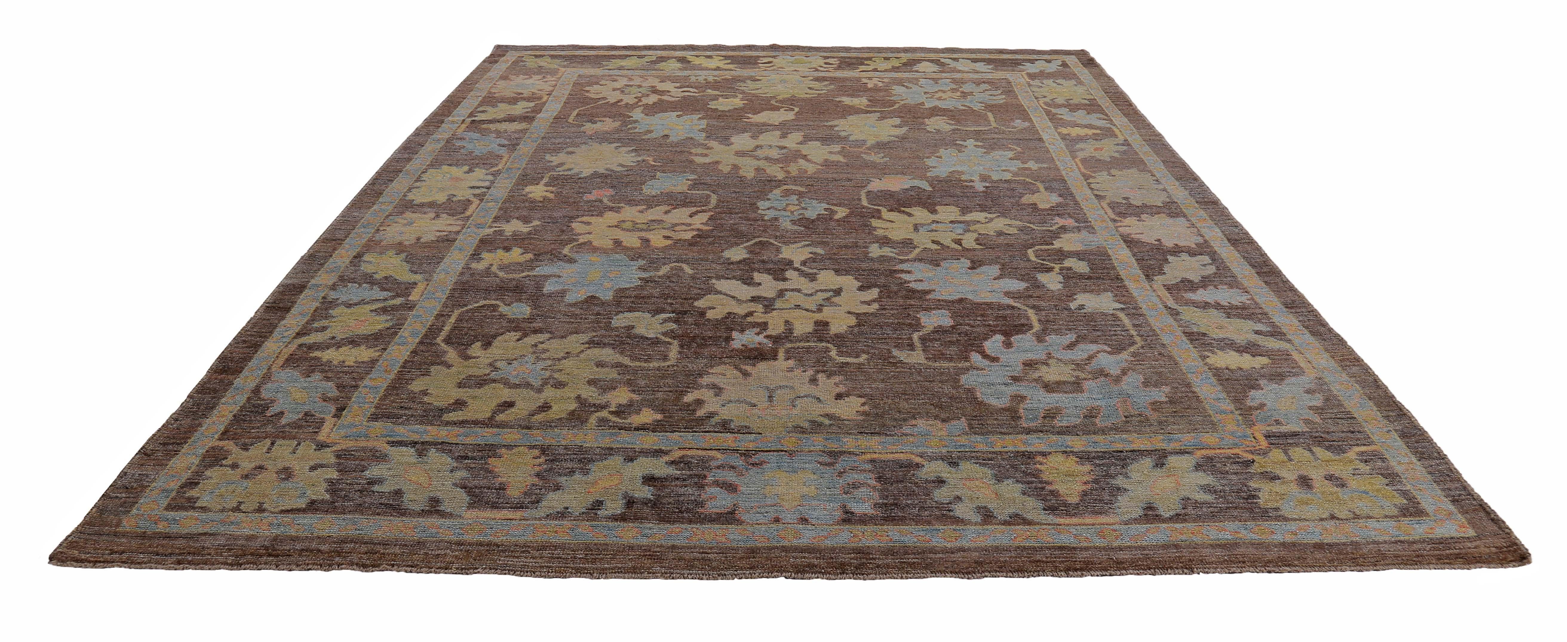 Turkish rug made of handwoven sheep’s wool of the finest quality. It’s colored with organic vegetable dyes that are certified safe for humans and pets alike. It features blue orange and green flower heads on a beautiful brown field. Flower patterns