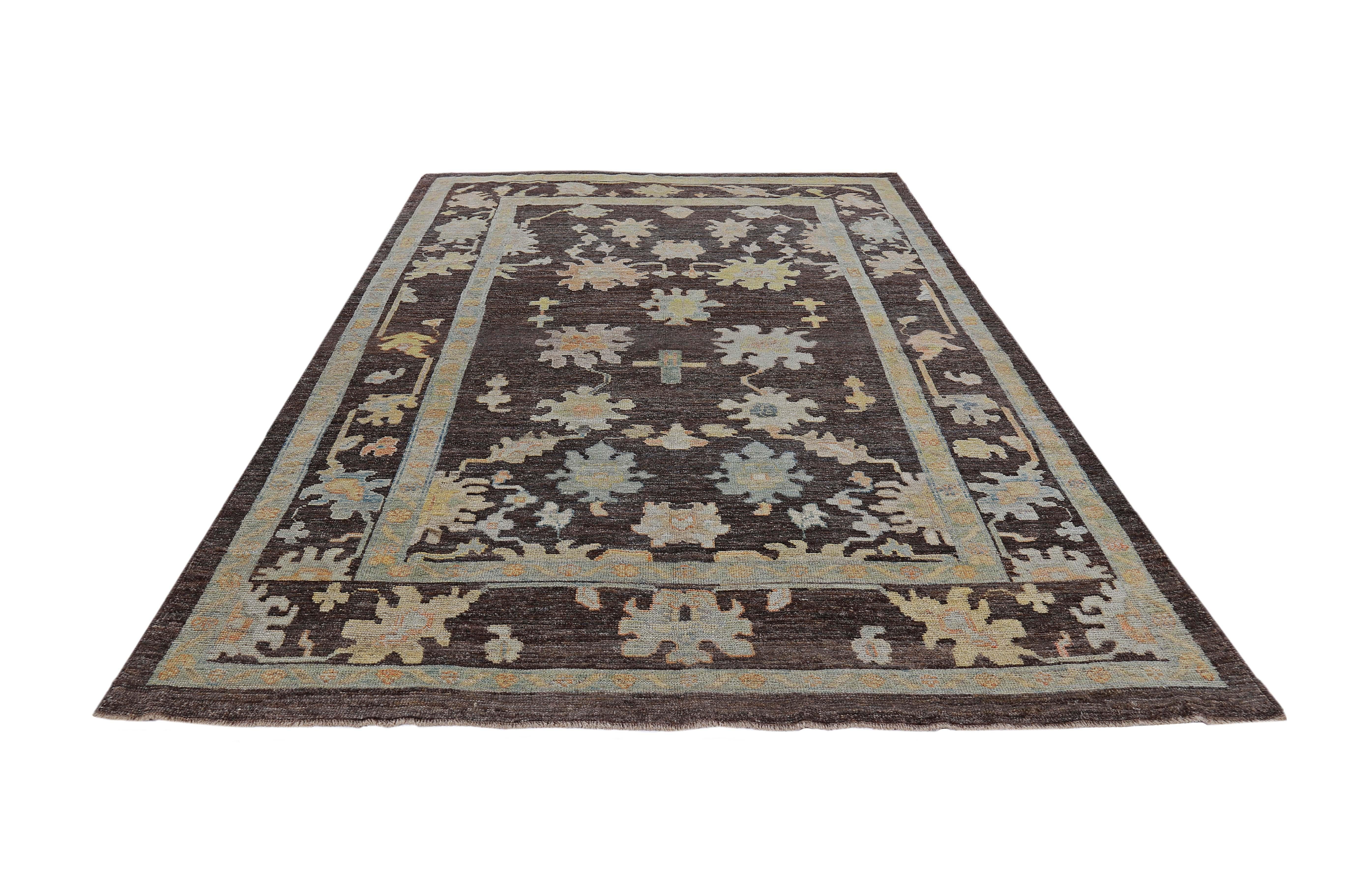 Turkish rug made of handwoven sheep’s wool of the finest quality. It’s colored with organic vegetable dyes that are certified safe for humans and pets alike. It features blue, orange and yellow flower heads on a beautiful brown field. Flower