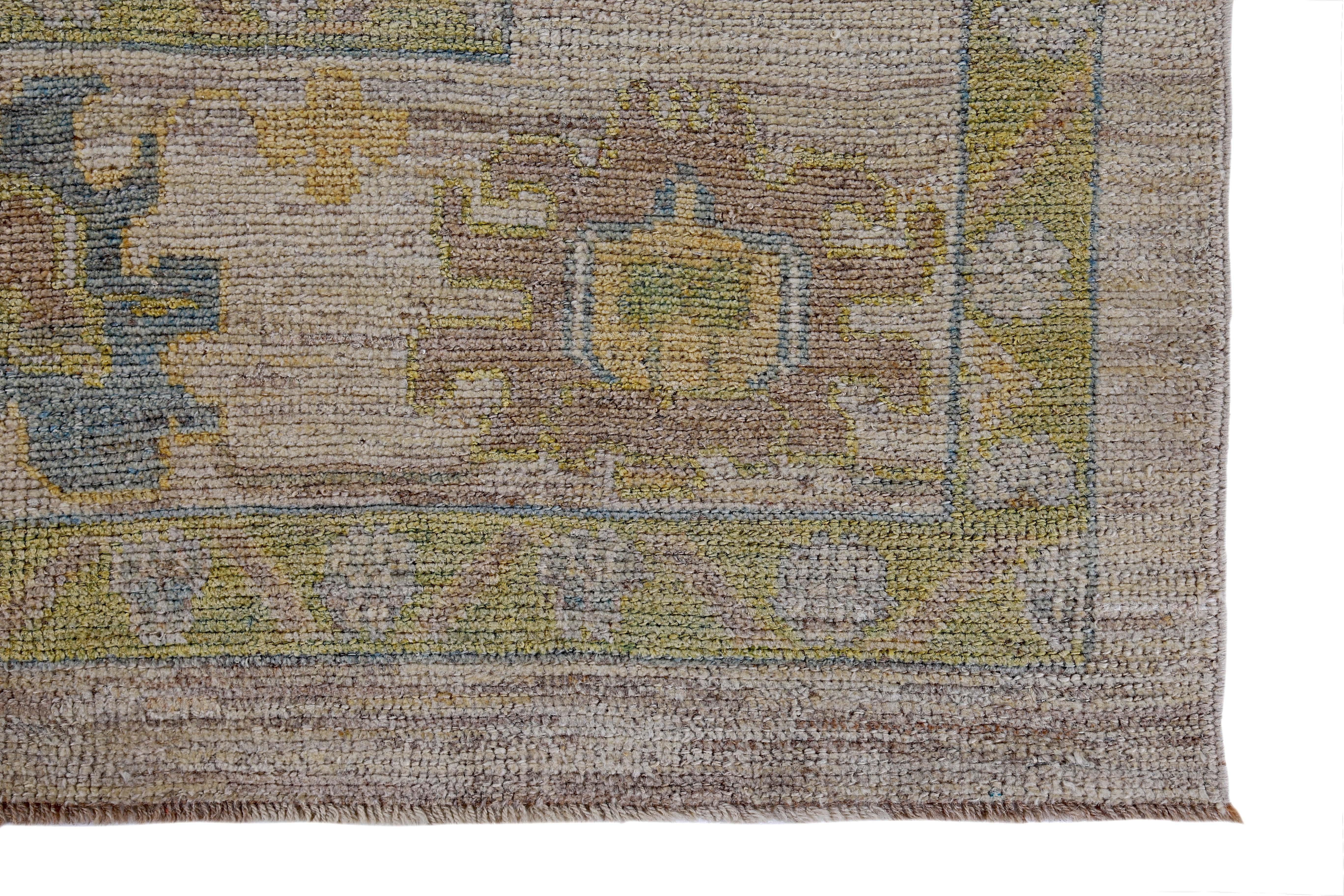 Wool Turkish Oushak Rug with Blue, Red and Green Flower Heads on Brown Field For Sale