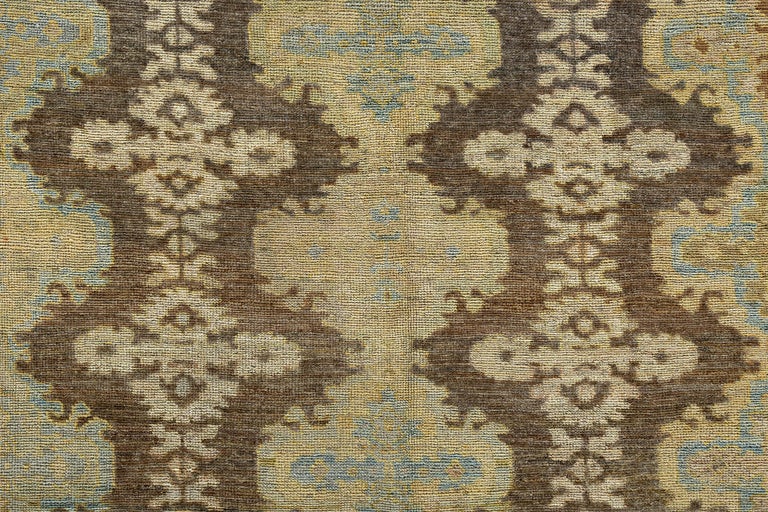 Turkish Oushak Rug with Blue, Yellow and Beige Flower Heads on Brown Field In New Condition For Sale In Dallas, TX