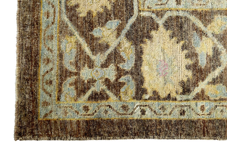 Contemporary Turkish Oushak Rug with Blue, Yellow and Beige Flower Heads on Brown Field For Sale