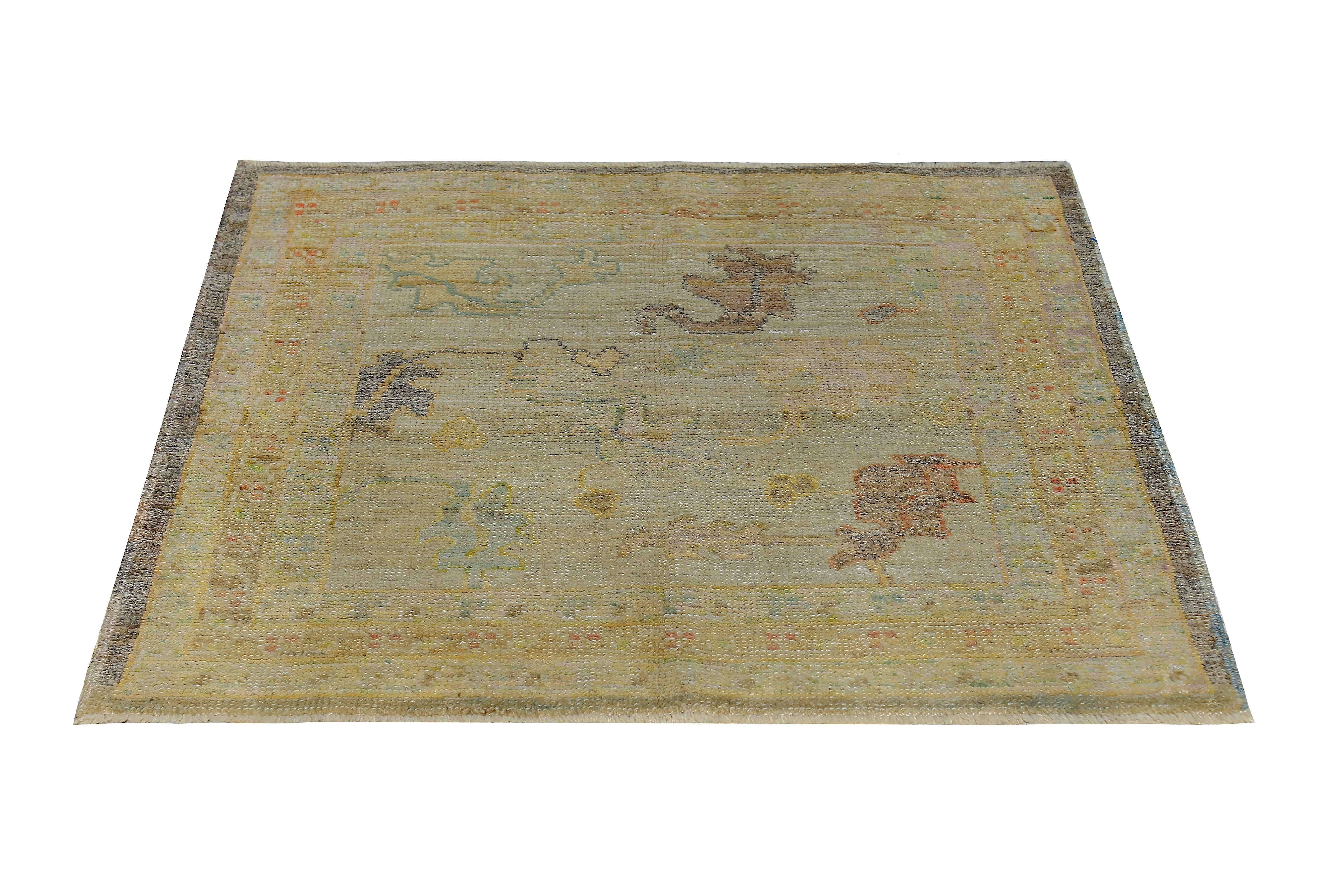 New Turkish rug made of handwoven sheep’s wool of the finest quality. It’s colored with organic vegetable dyes that are certified safe for humans and pets alike. It features brown and gold floral details on a beautiful ivory field. Flower patterns