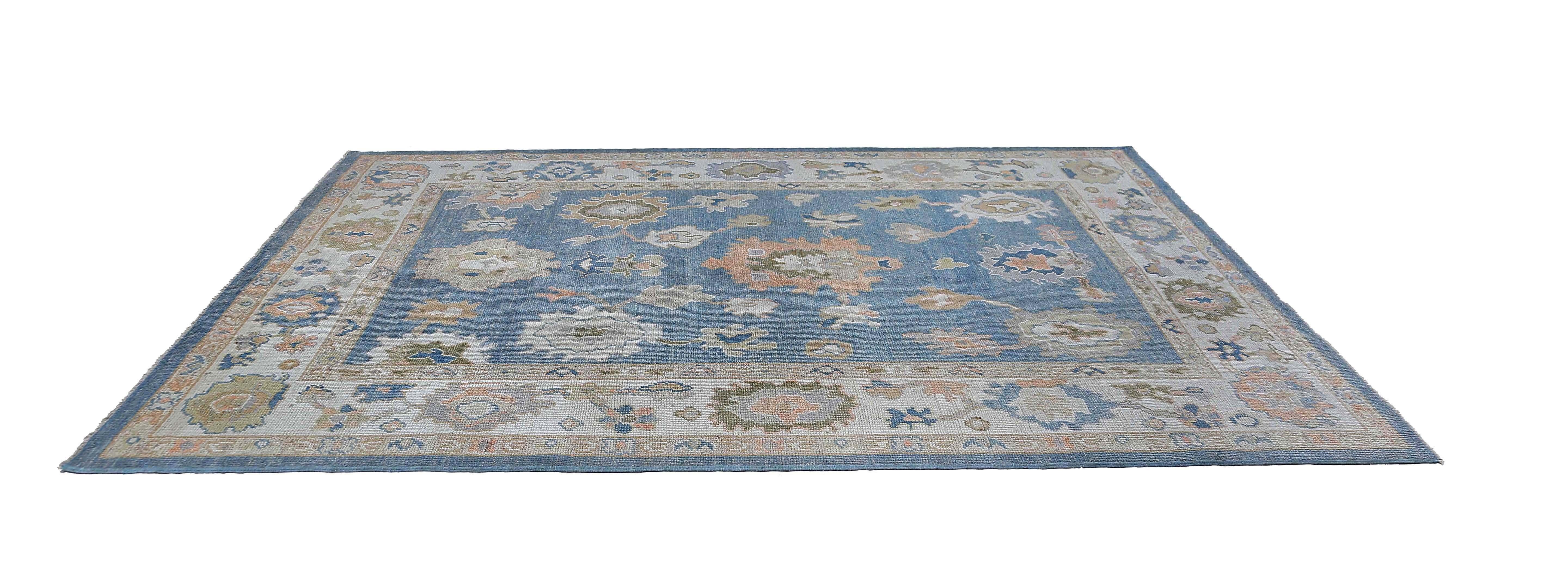 Introducing our exquisite 6'6'' x 9'6'' rug, featuring a stunning rich blue background and intricate motifs.

Crafted with the finest materials and expert craftsmanship, this rug is the perfect addition to any living space that needs a touch of